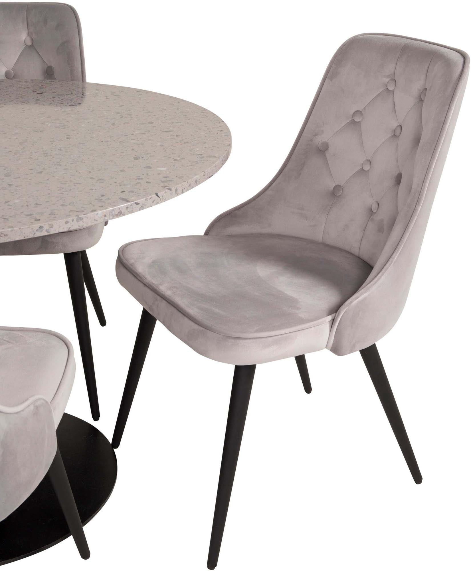 Elegantes Esszimmerset mit stilvollem Samtbezug und robustem Tisch für gesellige Momente und zeitlose Einrichtung.