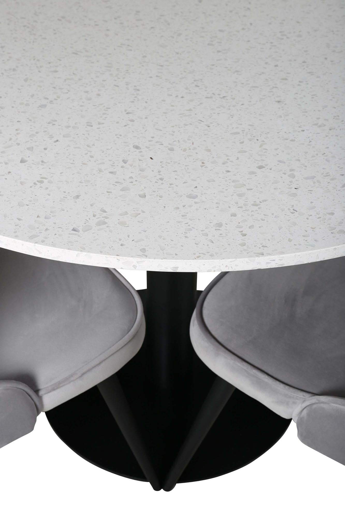 Stilvolles Esszimmerset mit luxuriösen Samtstühlen und elegantem Tisch. Perfekt für gesellige Runden und festliche Anlässe.