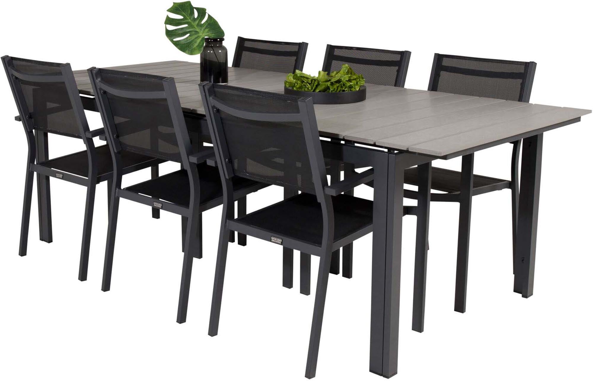 Elegantes Outdoor-Set für gesellige Abende: Robuster Tisch & bequeme Stühle für stilvolle Momente im Freien.