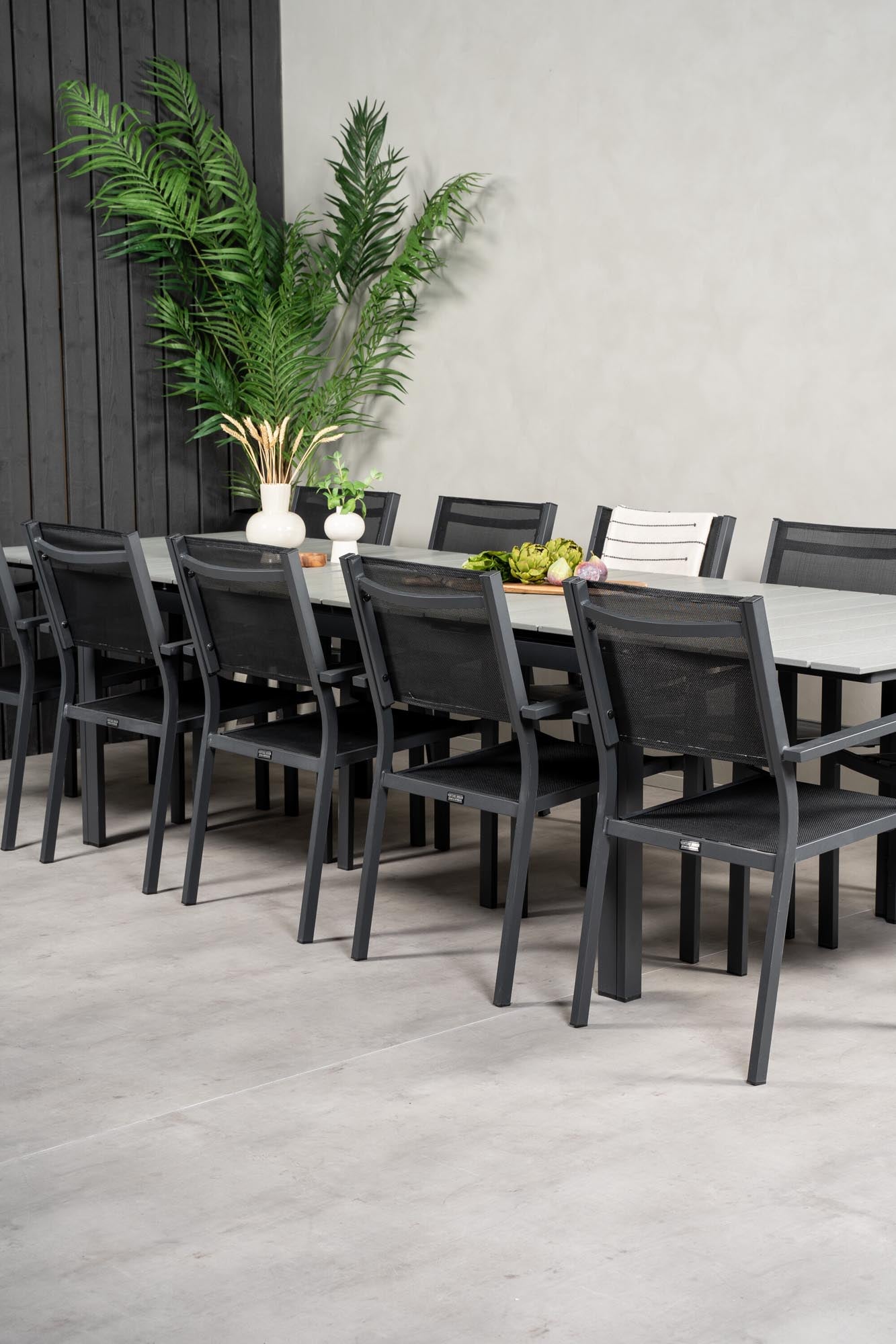 Stilvolles Outdoor-Tischset für gesellige Runden im Garten, robust und komfortabel für bis zu 8 Personen.