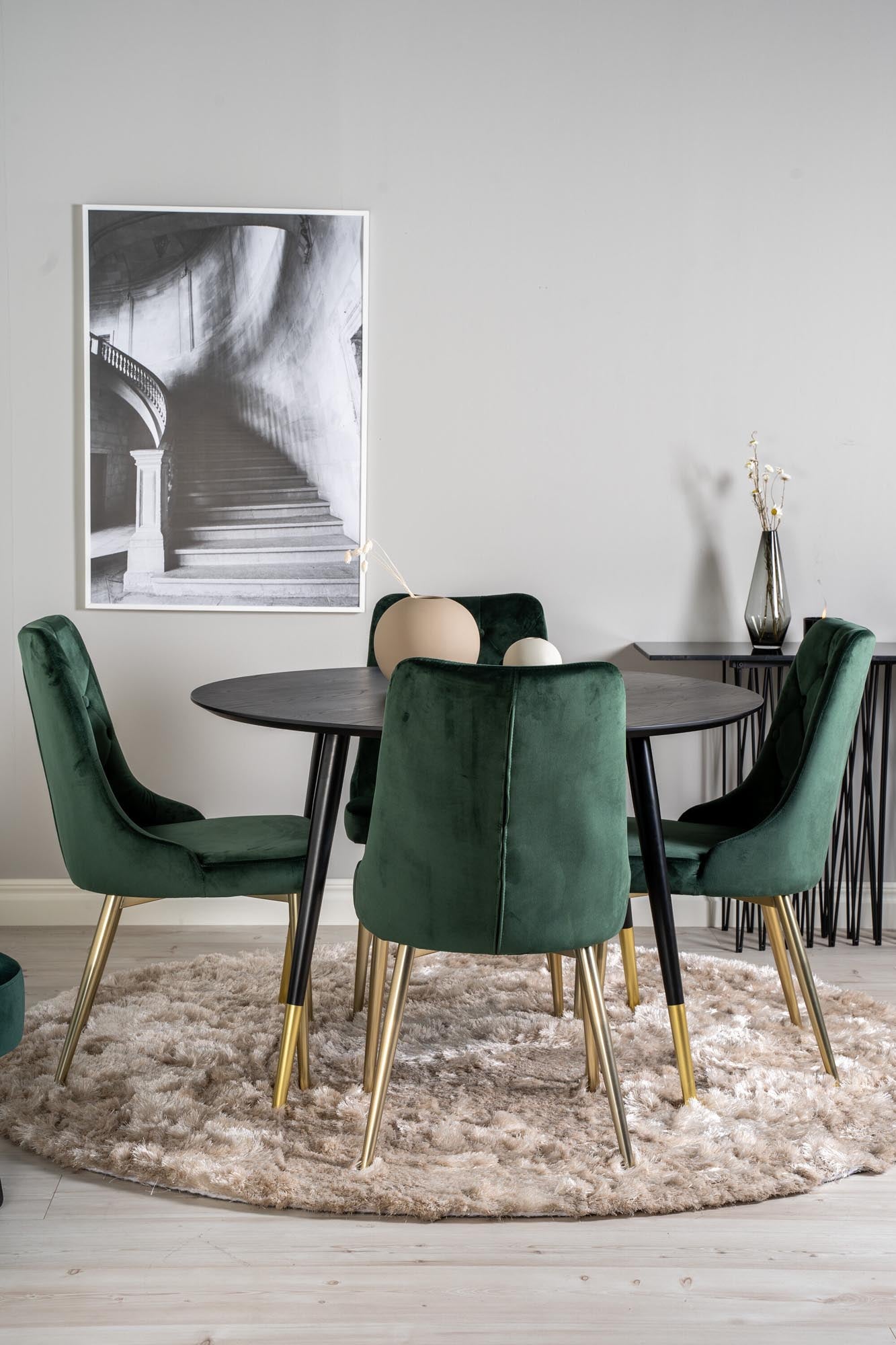 Elegantes Dipp Esszimmerset mit runden Tisch und luxuriösen Samtstühlen für gemütliche Essensmomente und stilvolle Einrichtung.