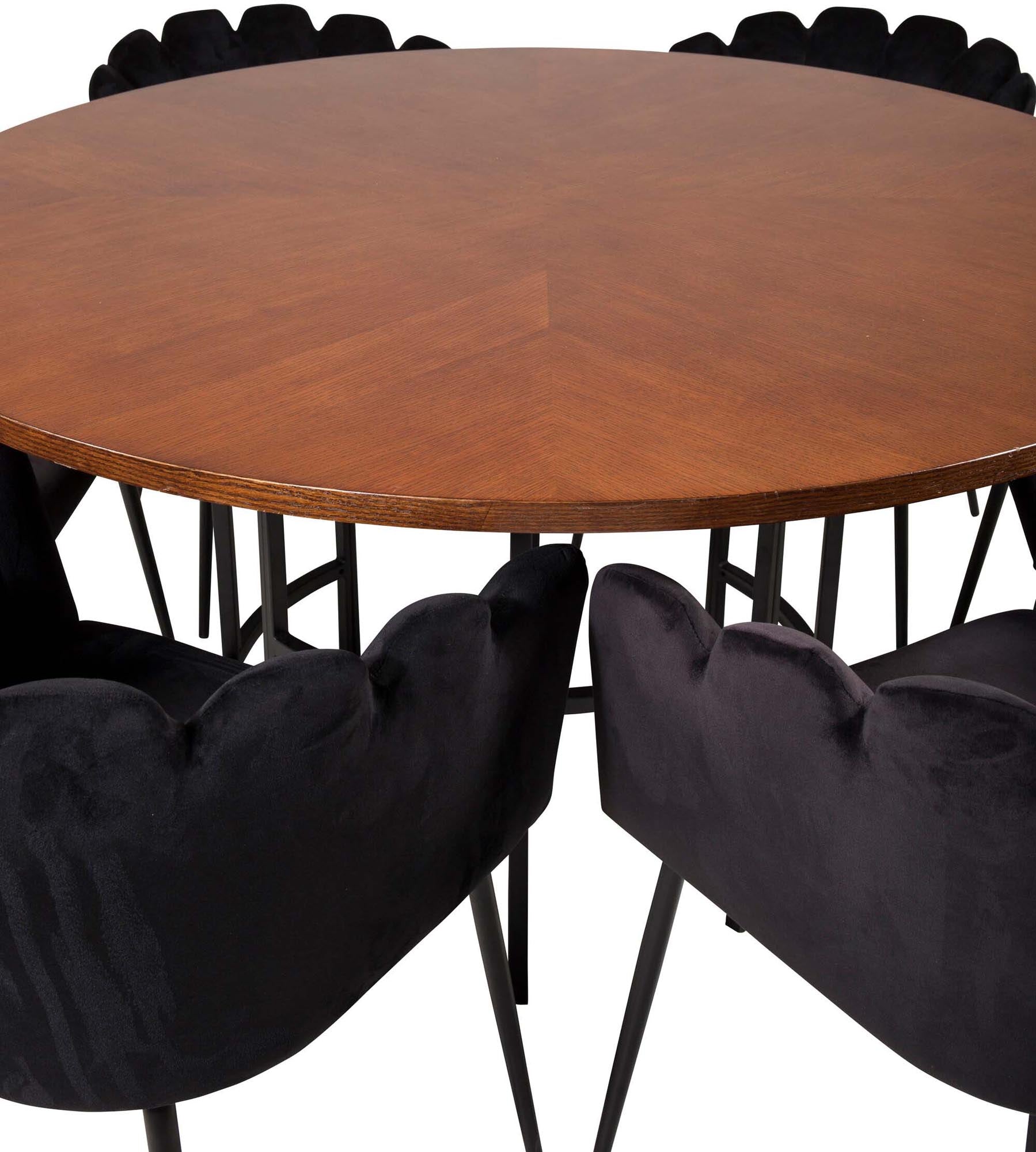 Elegantes Esszimmerset für gesellige Runden, mit Samtstühlen und pflegeleichtem Tisch.