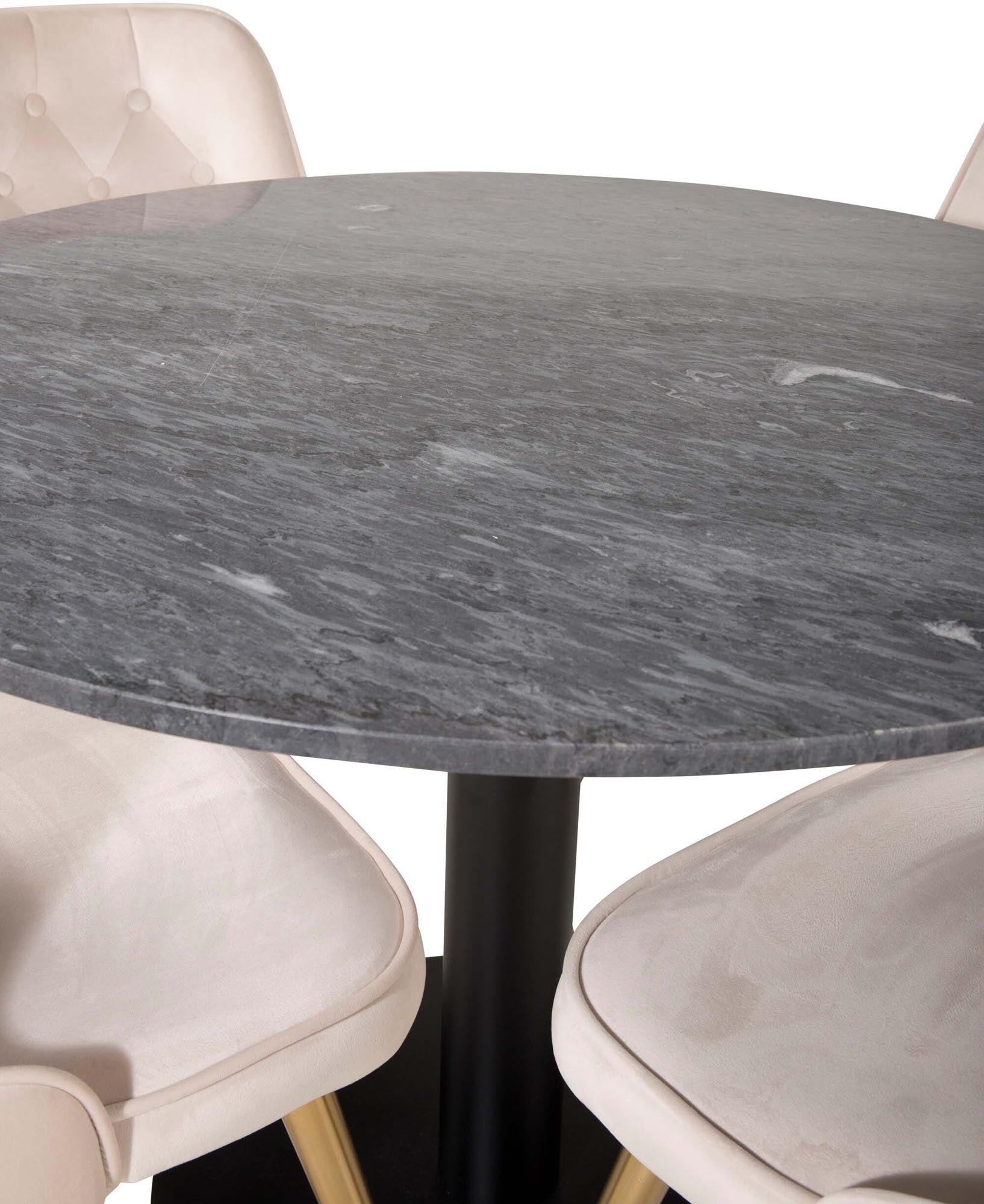 Elegantes Esszimmerset mit rundem Tisch und vier Samtstühlen.