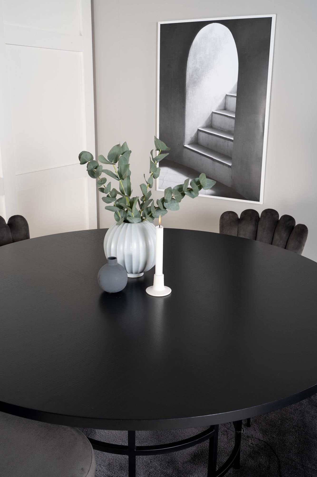 Rundes Esszimmerset mit elegantem Design und luxuriösem Samtbezug für unvergessliche Dinnerpartys und gemütliche Familienessen.