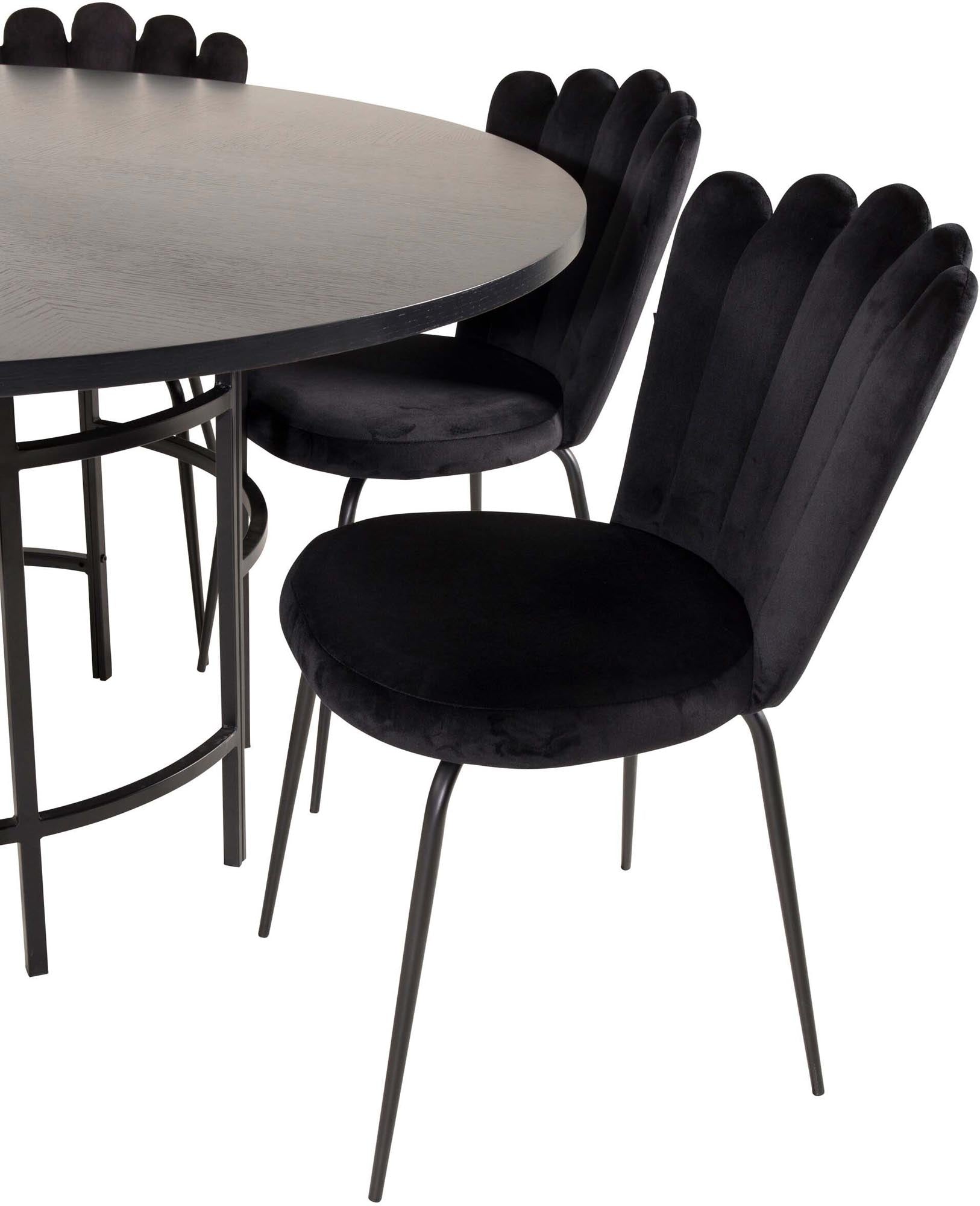 Stilvolles Esszimmerset mit runden Tisch und luxuriösen Samtstühlen. Perfekt für gesellige Abende mit bis zu 6 Personen.