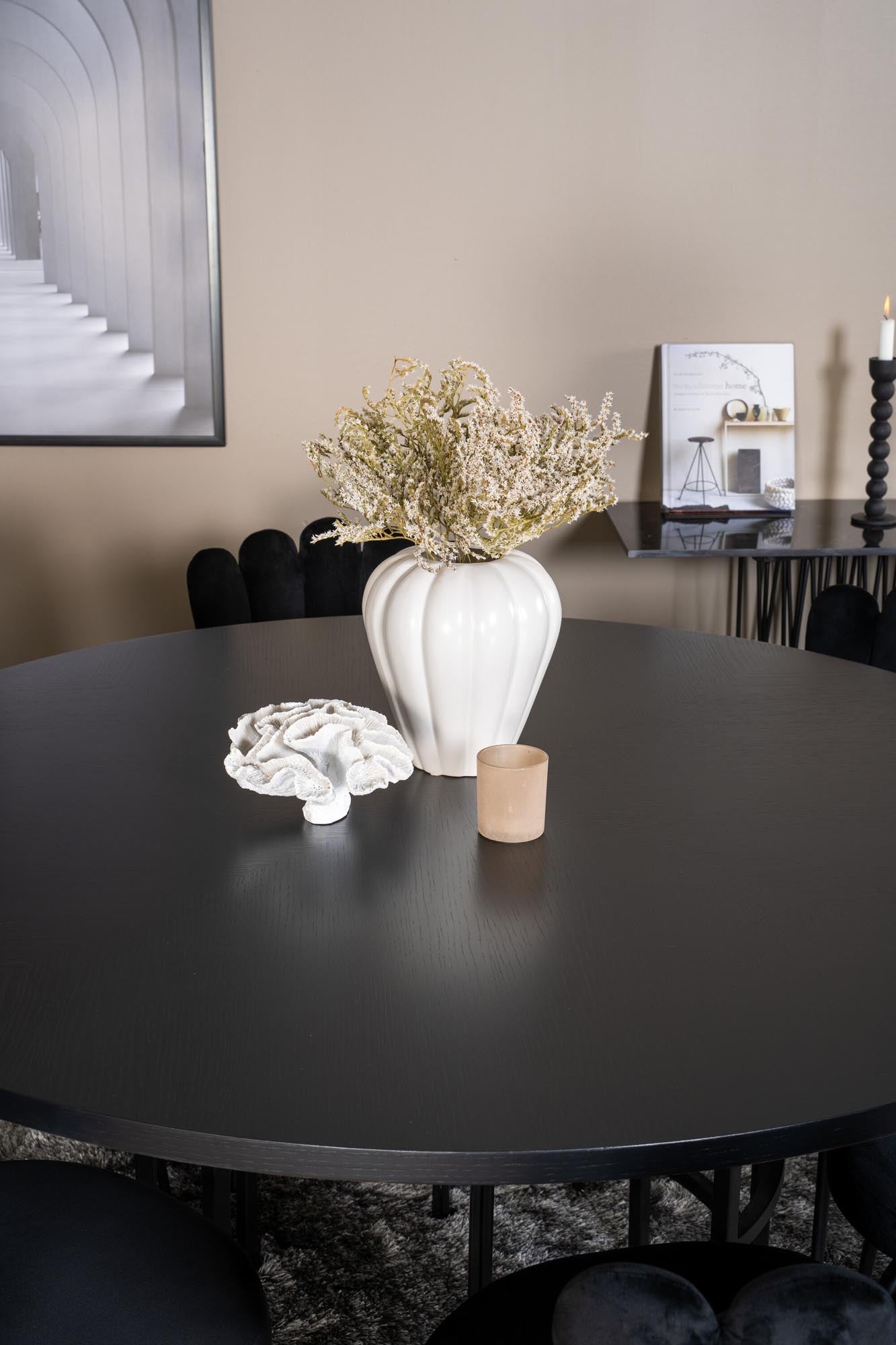 Rundes Esszimmerset für 6 Personen mit luxuriösem Samtbezug und elegantem Design. Ideal für gesellige Abende und stilvolle Einrichtung.