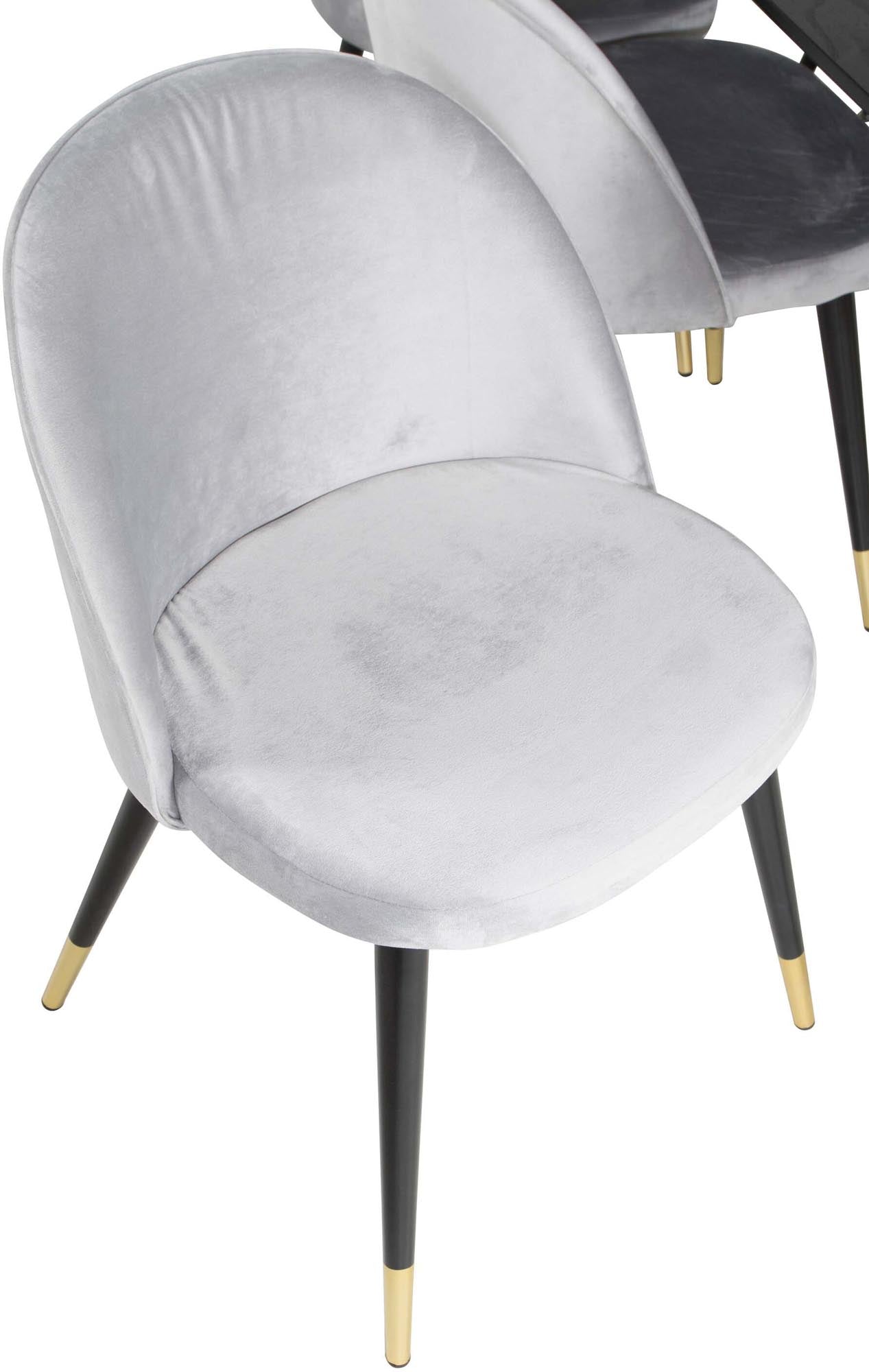 Stilvolles, ausziehbares Gold Esszimmerset mit bequemen Samt-Stühlen. Perfekt für festliche Anlässe und gemütliche Familienabende.