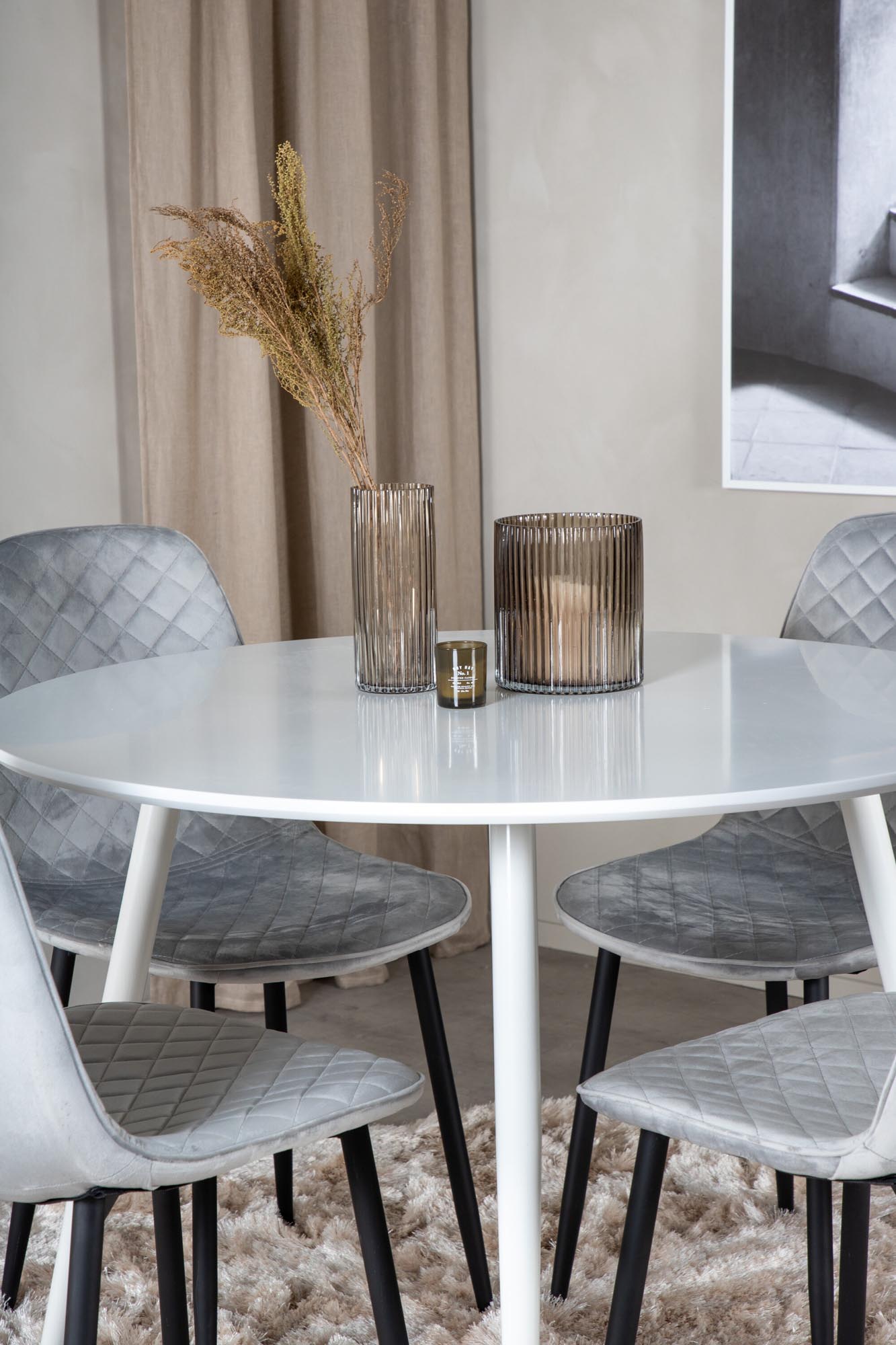 Stilvolles Plaza Esszimmerset mit rundem 100 cm Tisch und 4 eleganten Samtstühlen Polar für gemütliche Essrunden und luxuriöse Atmosphäre.