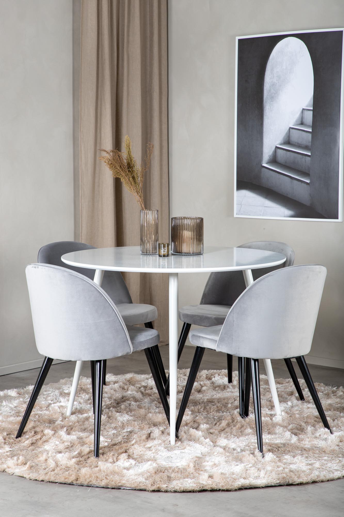 Elegantes Esszimmer-Set: Runder Tisch mit 4 luxuriösen Samtstühlen, ideal für gesellige Abende und festliche Anlässe.