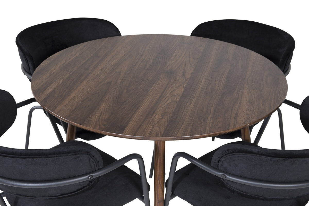 Rundes Esszimmerset zeigt Holztisch mit Nussbaum-Platte ⌀100 cm und zwei schwarze Stühle aus MDF und Stahl mit Samtbezug.