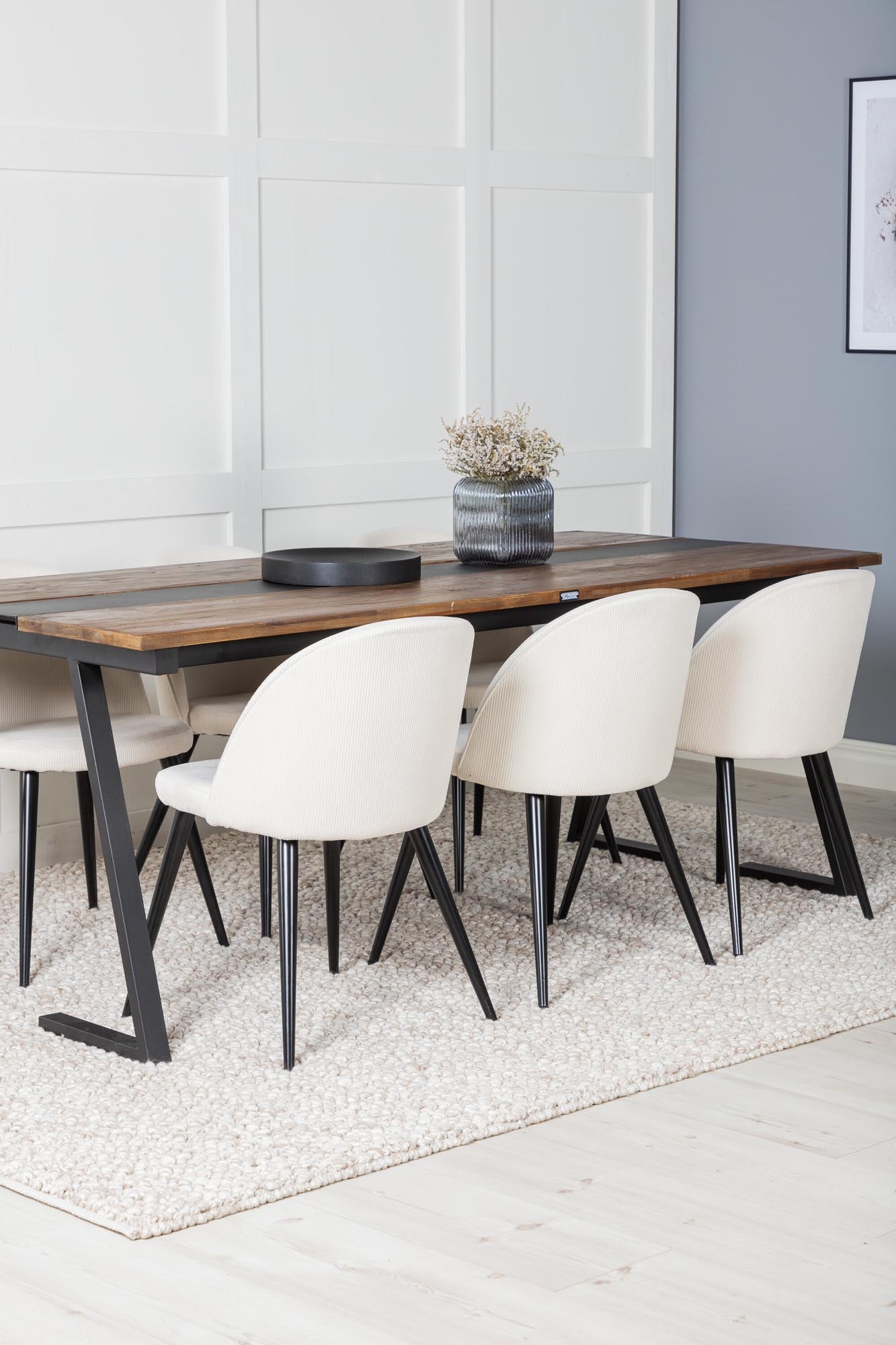 Entdecken Sie das Jakarta Esszimmerset von Venture Home: 200 cm Tisch für bis zu 6 Personen, kombiniert mit eleganten Velvet-Stühlen und einzigartiger Holzmaserung.