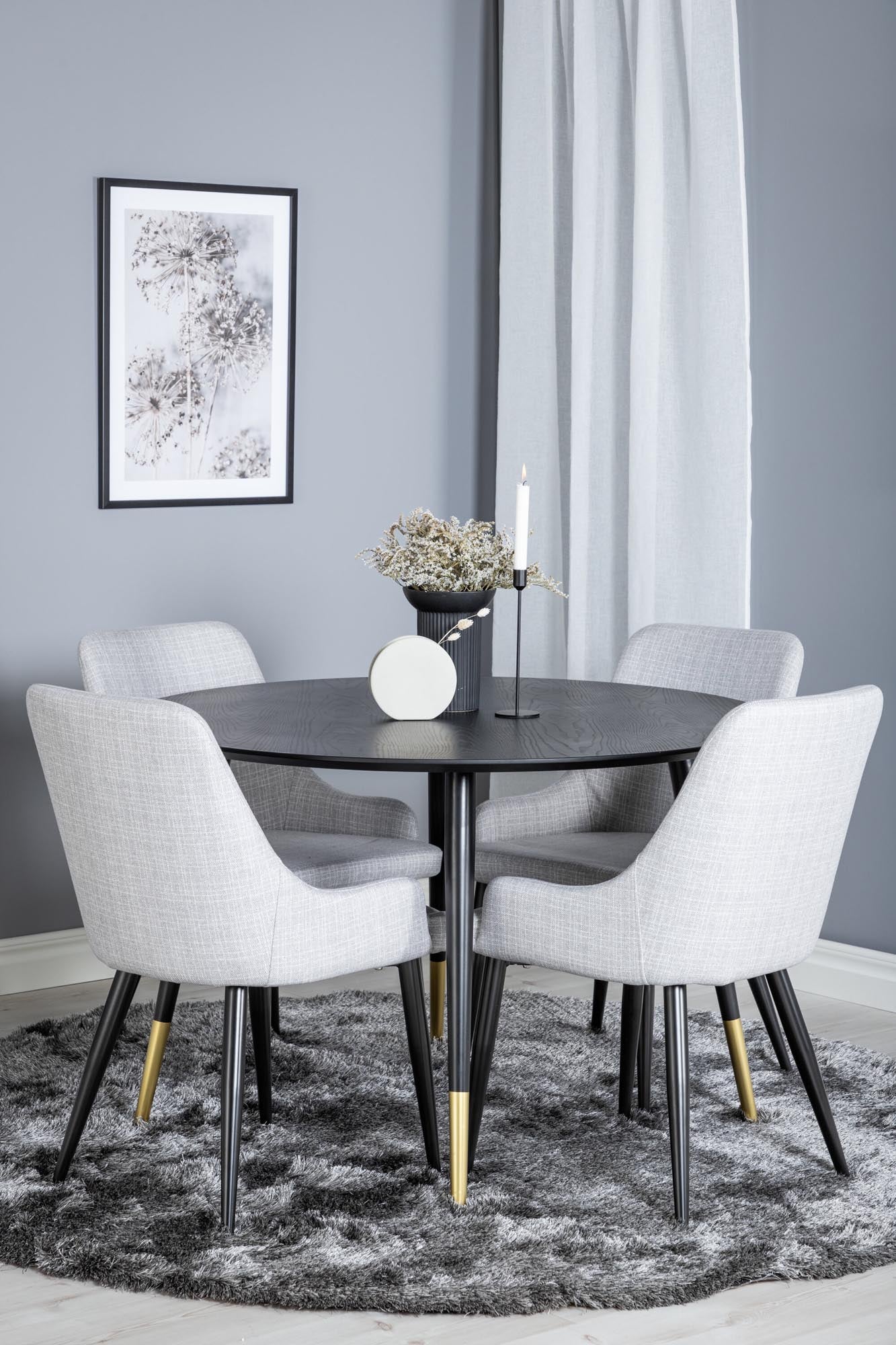 Entdecken Sie das Dipp Esszimmerset von Venture Home: runder Tisch (⌀115cm) und 4 stilvolle Stühle aus robustem Polyester. Ideal für gesellige Abende!