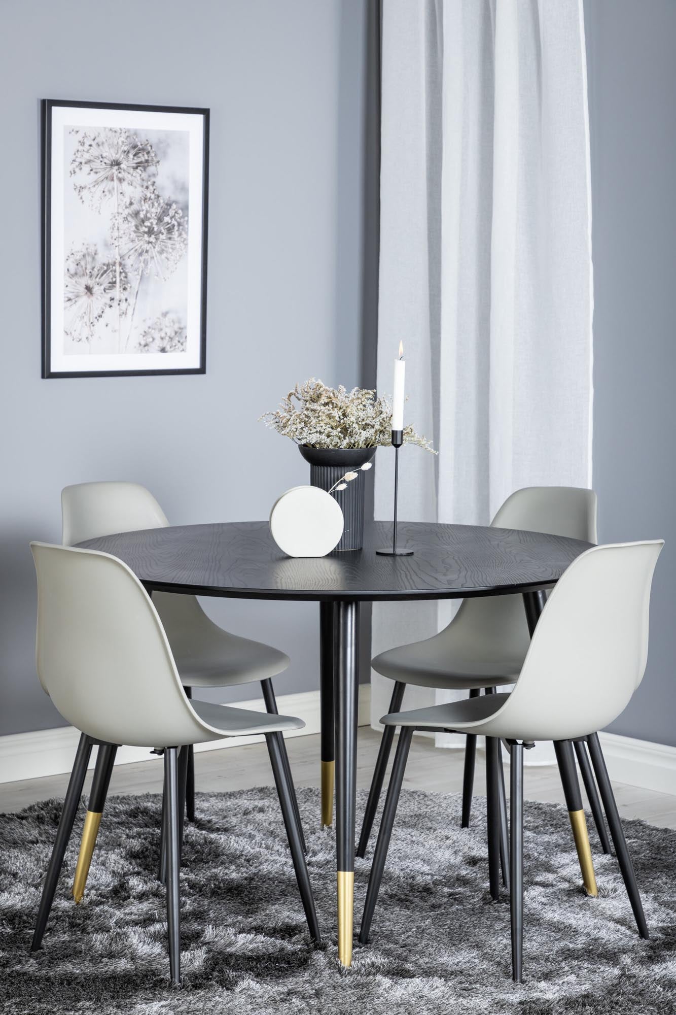 Entdecken Sie das Dipp Esszimmerset + Polar: runder Tisch (115 cm) und 4 komfortable Stühle, perfekt für gesellige Abende und langlebig für drinnen und draußen.