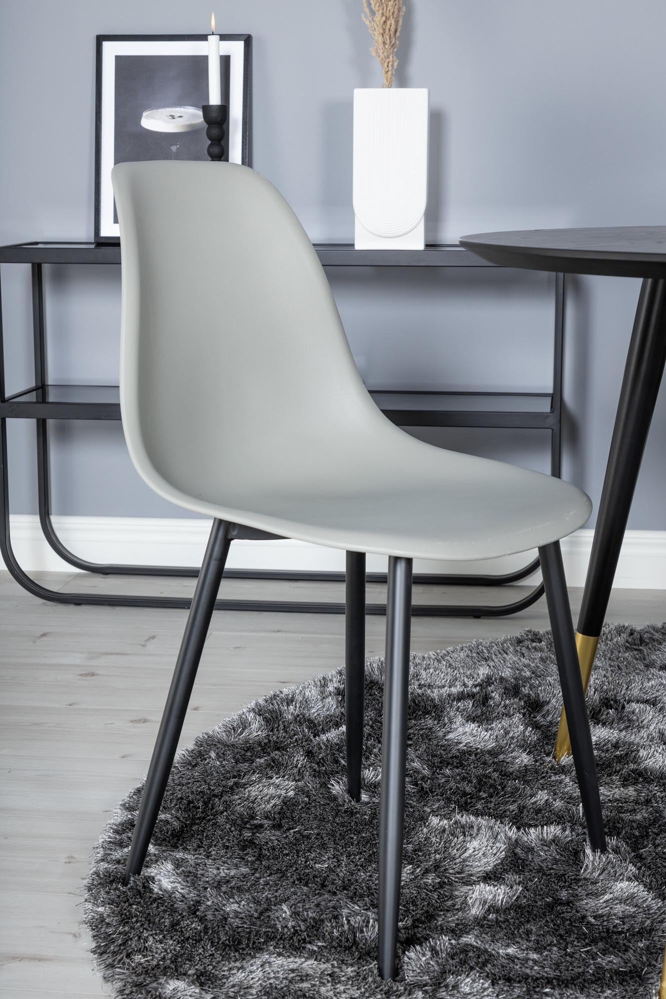 Erleben Sie das Dipp Esszimmerset + Polar: stilvoller runder Tisch (115 cm) und 4 ergonomische Stühle, ideal für gesellige Runden und vielseitig einsetzbar.