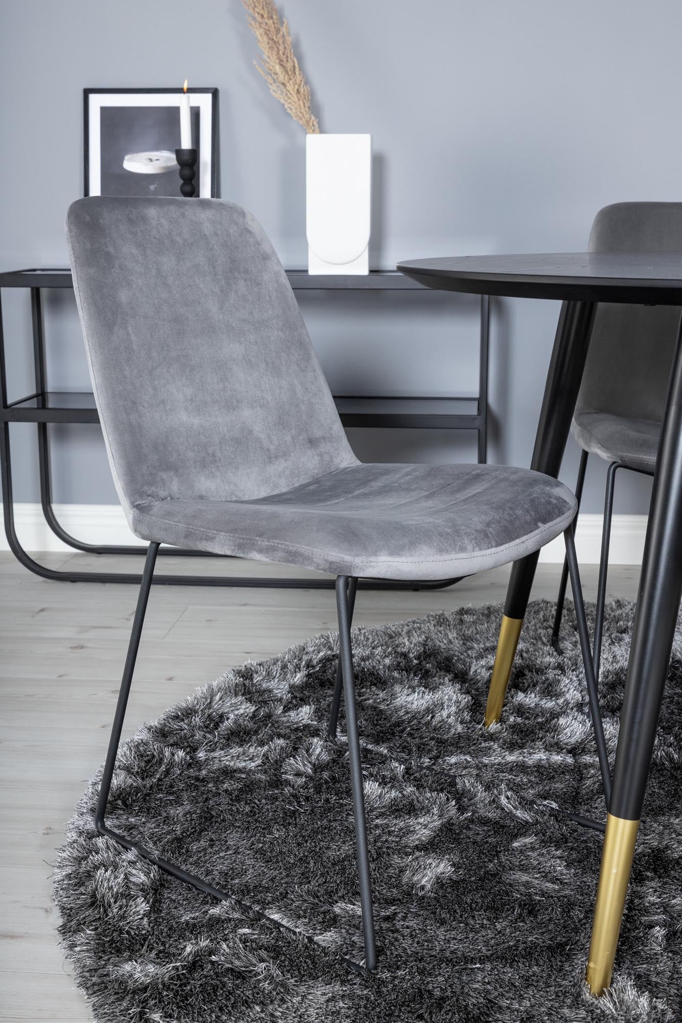 Stilvolles Dipp Esszimmerset + Muce: Runder Tisch und bequeme Stühle für gesellige Momente und luxuriösen Komfort in Ihrem Essbereich.