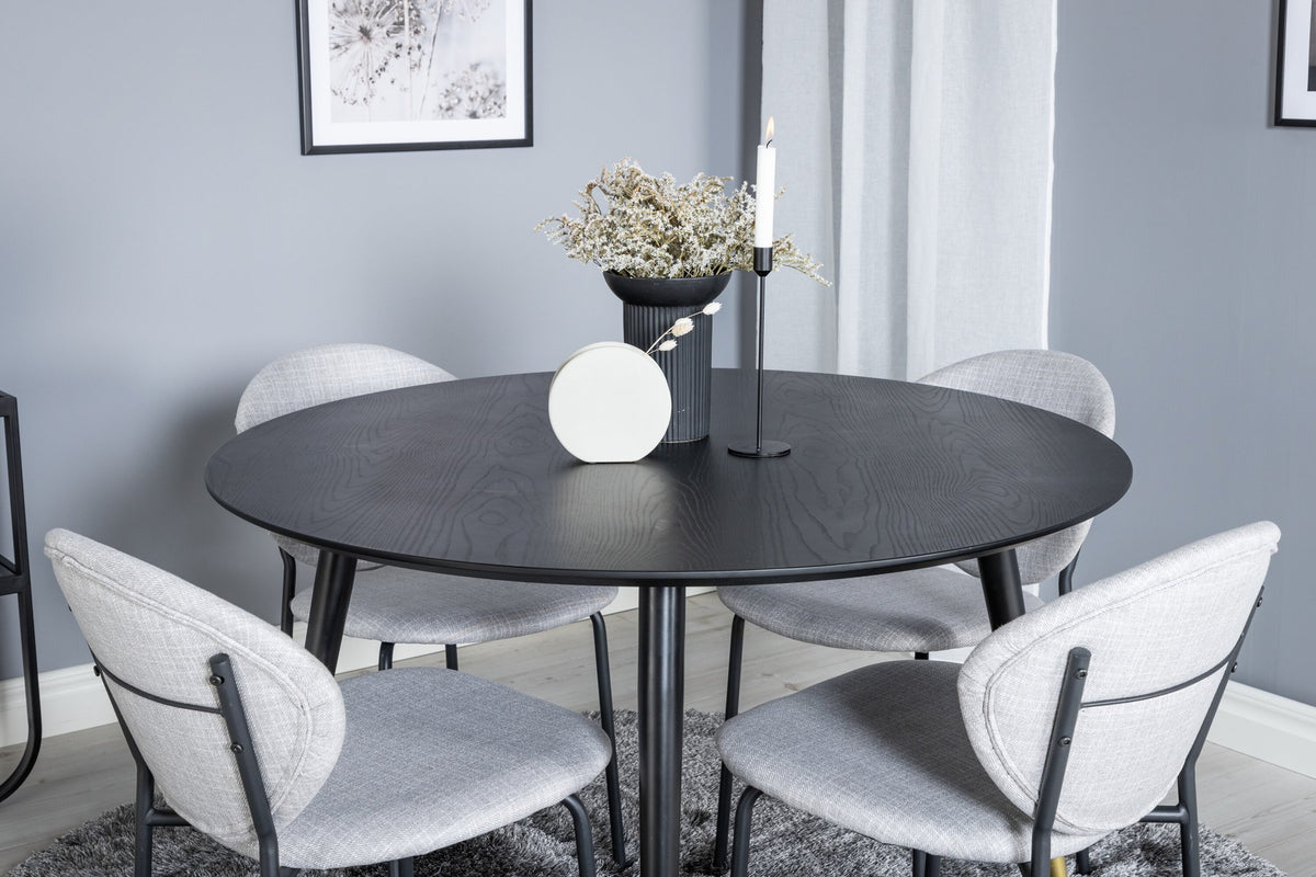Schwarzes Esszimmerset Dipp mit Vault Stühlen: Tisch mit MDF-Furnierplatte und Stahlbeinen, Stühle mit Polsterbezug und Stahlgestell.