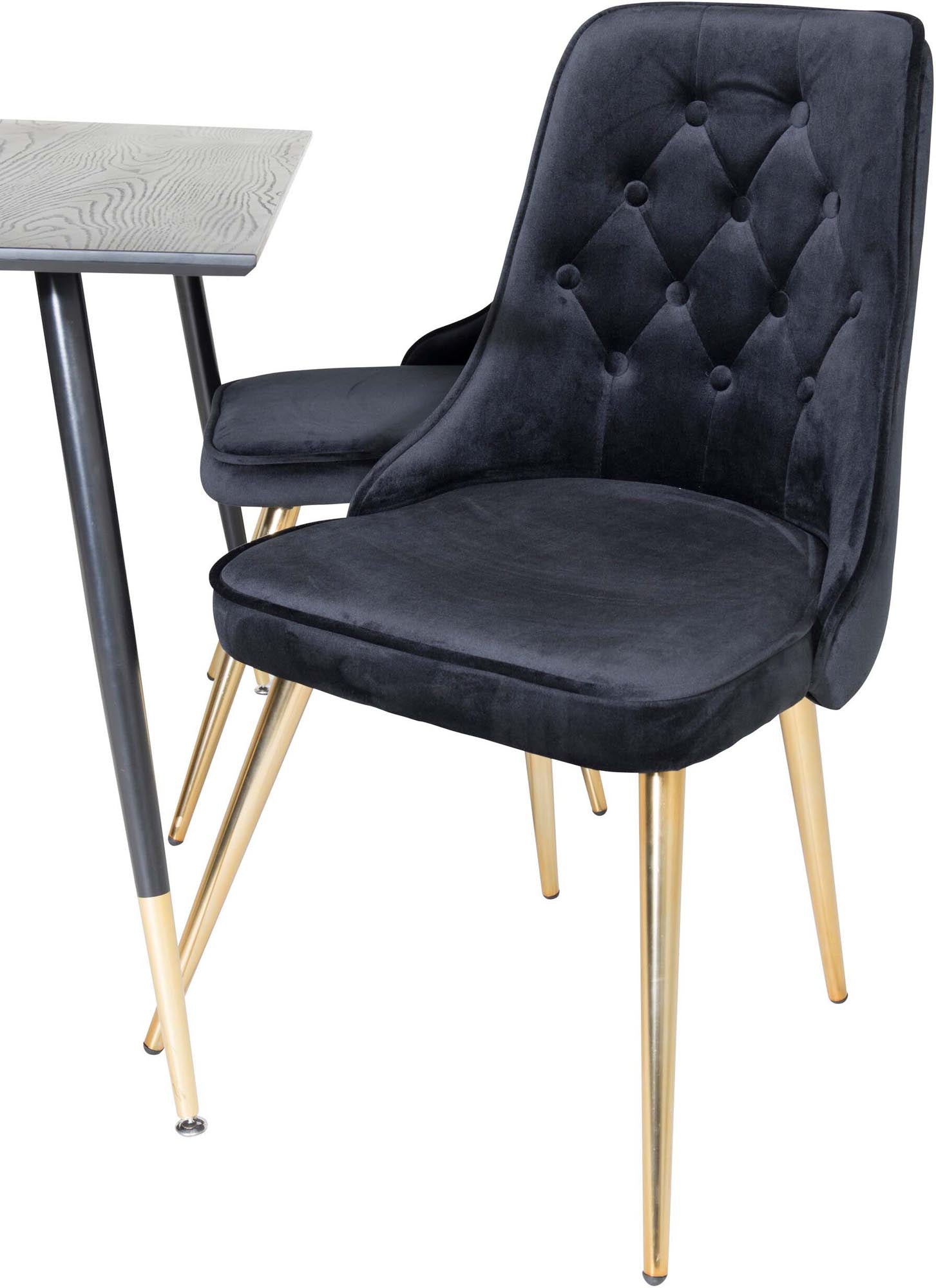 Elegantes Esszimmerset mit Samtstühlen für stilvolle Mahlzeiten.