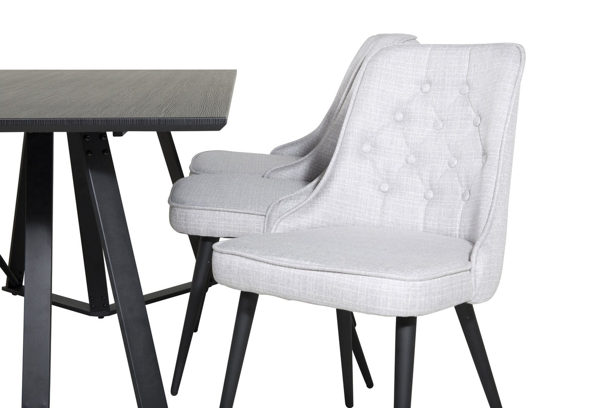 Esszimmerset von Venture Home: rechteckiger Esstisch mit schwarzer MDF-Platte und Stahlgestell, zwei graue Samt-Stühle mit gepolstertem Sitz.