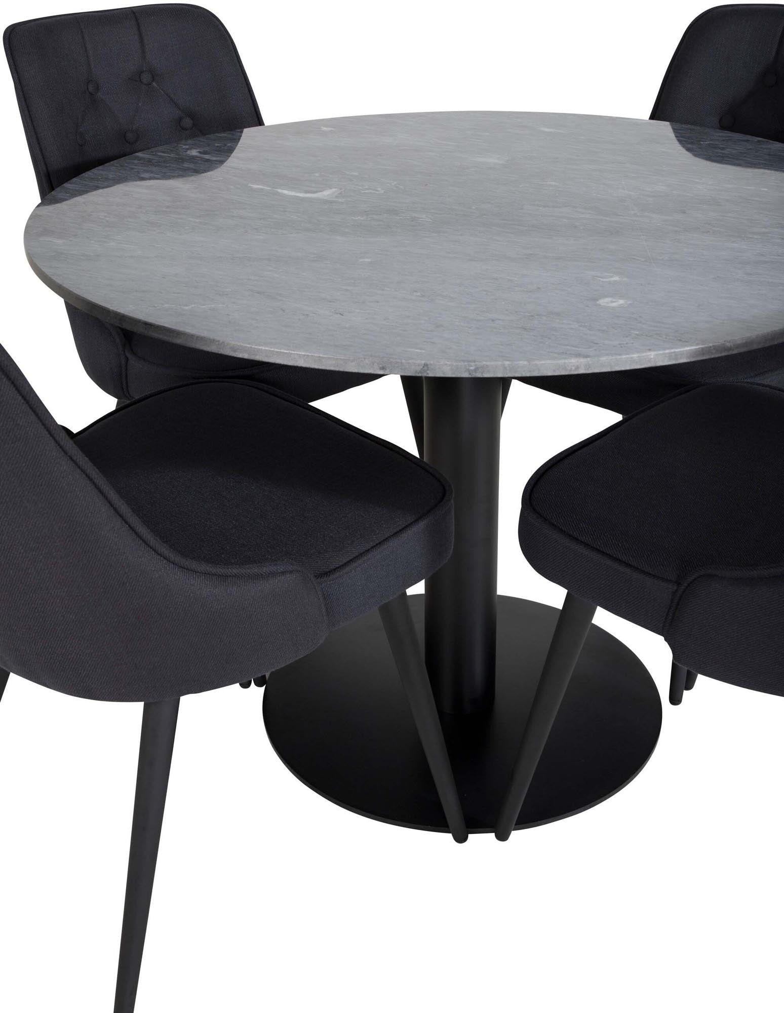 Elegantes Esszimmerset mit rundem Tisch und vier Samtstühlen.