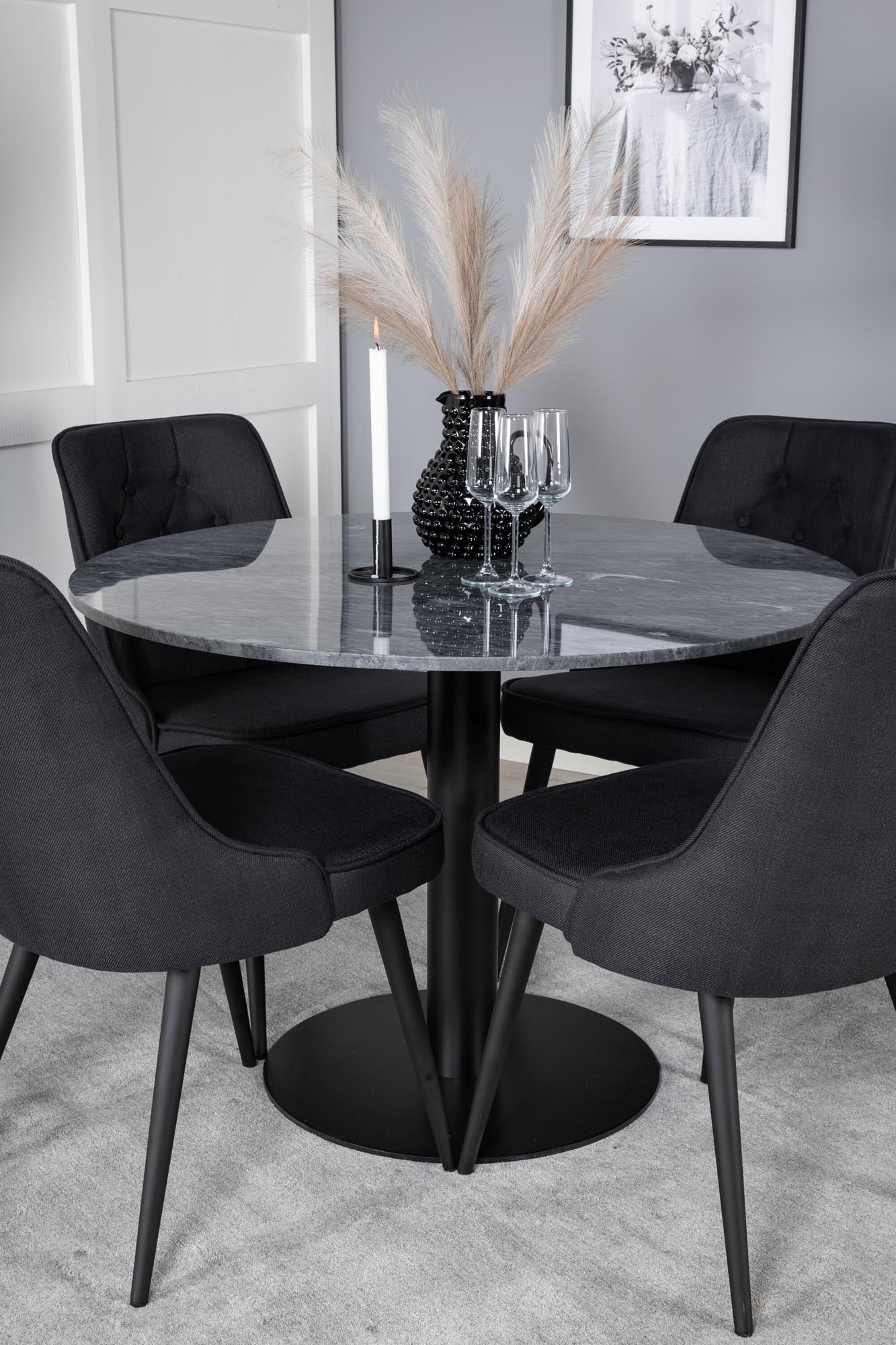 Elegantes Esszimmerset mit runder Marmortischplatte und luxuriösen Samtstühlen. Ideal für gesellige Abende und stilvolle Anlässe.