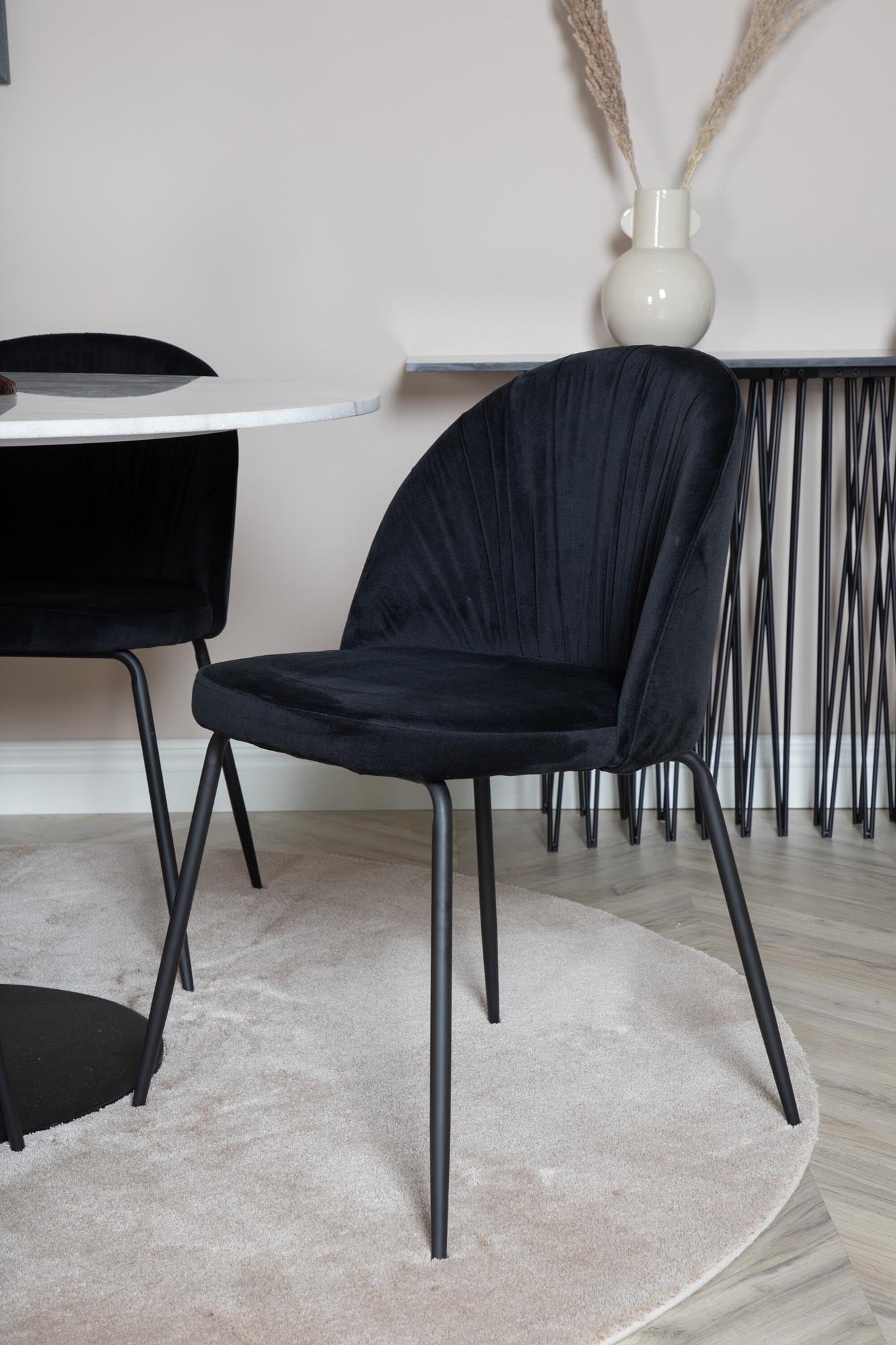 Entdecken Sie das Estelle Esszimmerset + Wrinkles: Eleganz trifft Komfort mit Marmor und Samt für unvergessliche Essmomente.