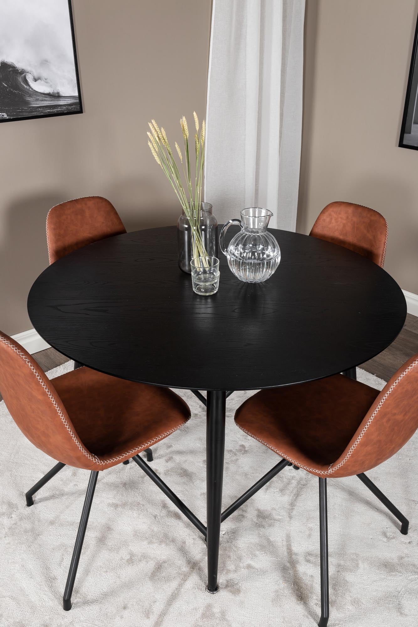 Erleben Sie das Dipp Esszimmerset + Polar von Venture Home: Stilvoller runder Tisch und ergonomische Stühle für gesellige Runden und höchsten Komfort.