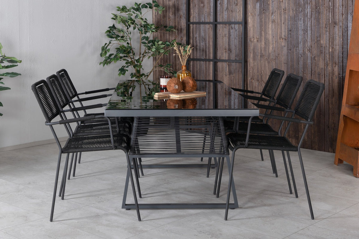 Esstisch Dallas mit sechs Stühlen Lindos, Gestell aus Aluminium und Geflecht in Schwarz, Tischplatte aus Glas, Outdoor-Set von Venture Home.
