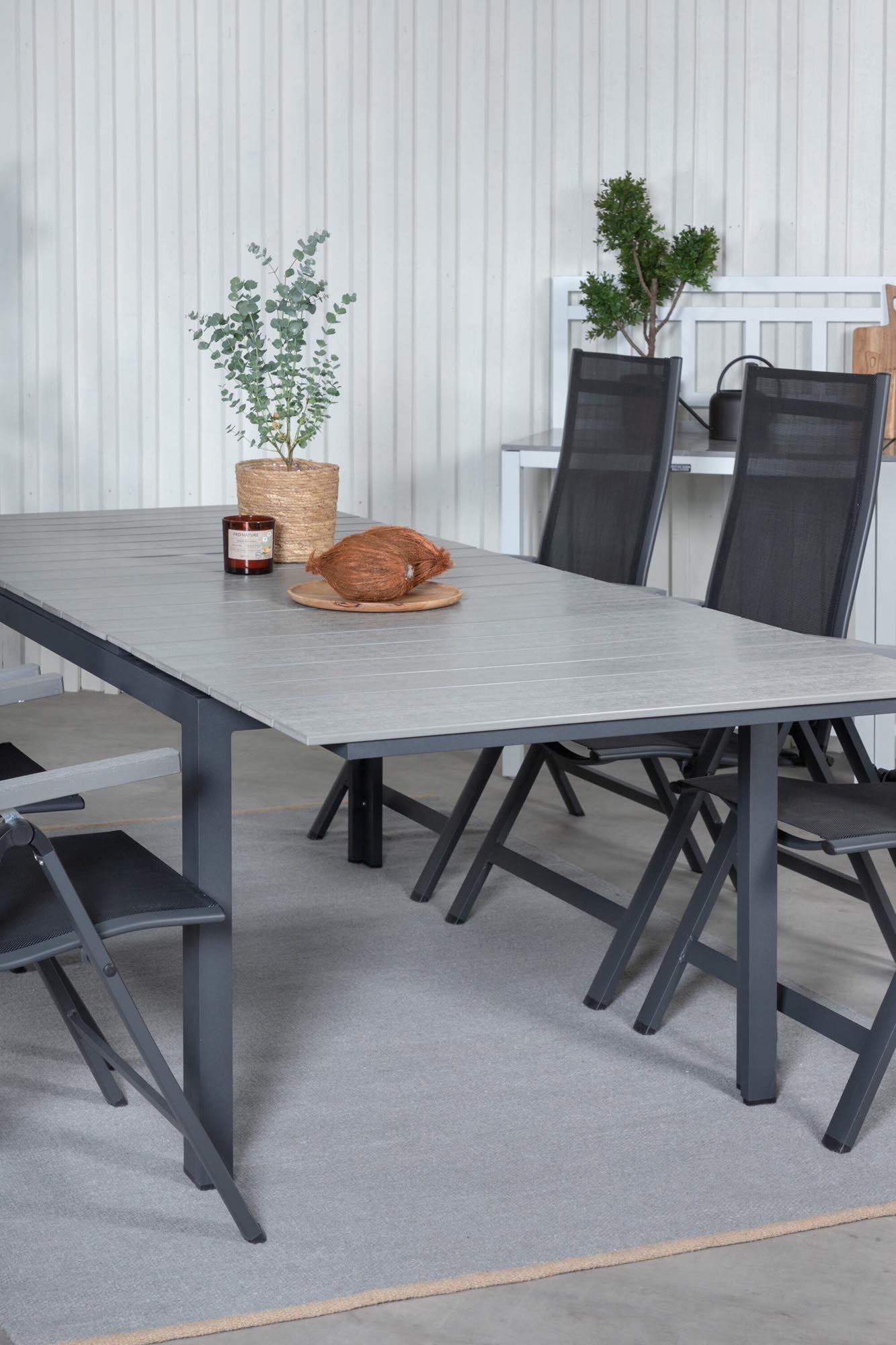 Entdecken Sie das elegante Levels Outdoor-Tischset mit ausziehbarem Tisch und 6 bequemen Albany Stühlen – perfekt für entspannte Abende im Freien.