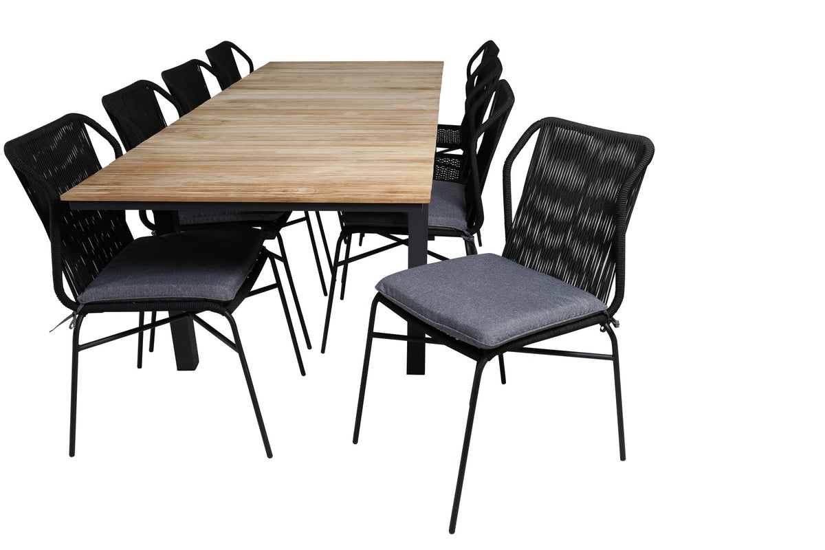 Vier schwarze Esszimmerstühle aus Aluminium mit Seilbezug und ausziehbarer rechteckiger Teakholz-Esstisch mit Stahlbeinen, Naturfarben.