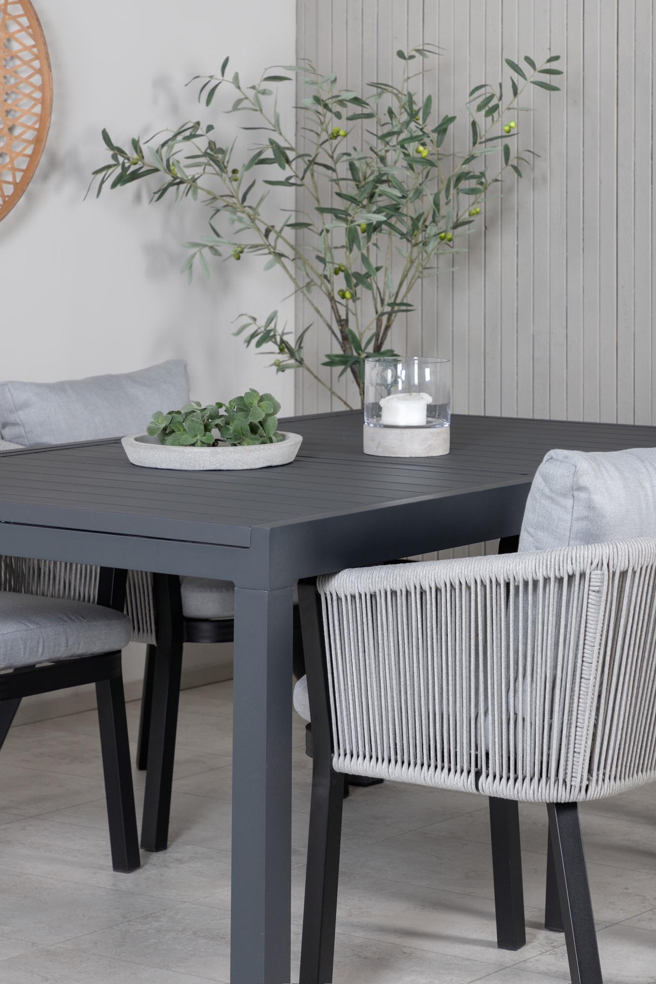 Elegantes Marbella Set: Ausziehbarer Tisch & 4 Virya Stühle für stilvolle Outdoor-Momente.