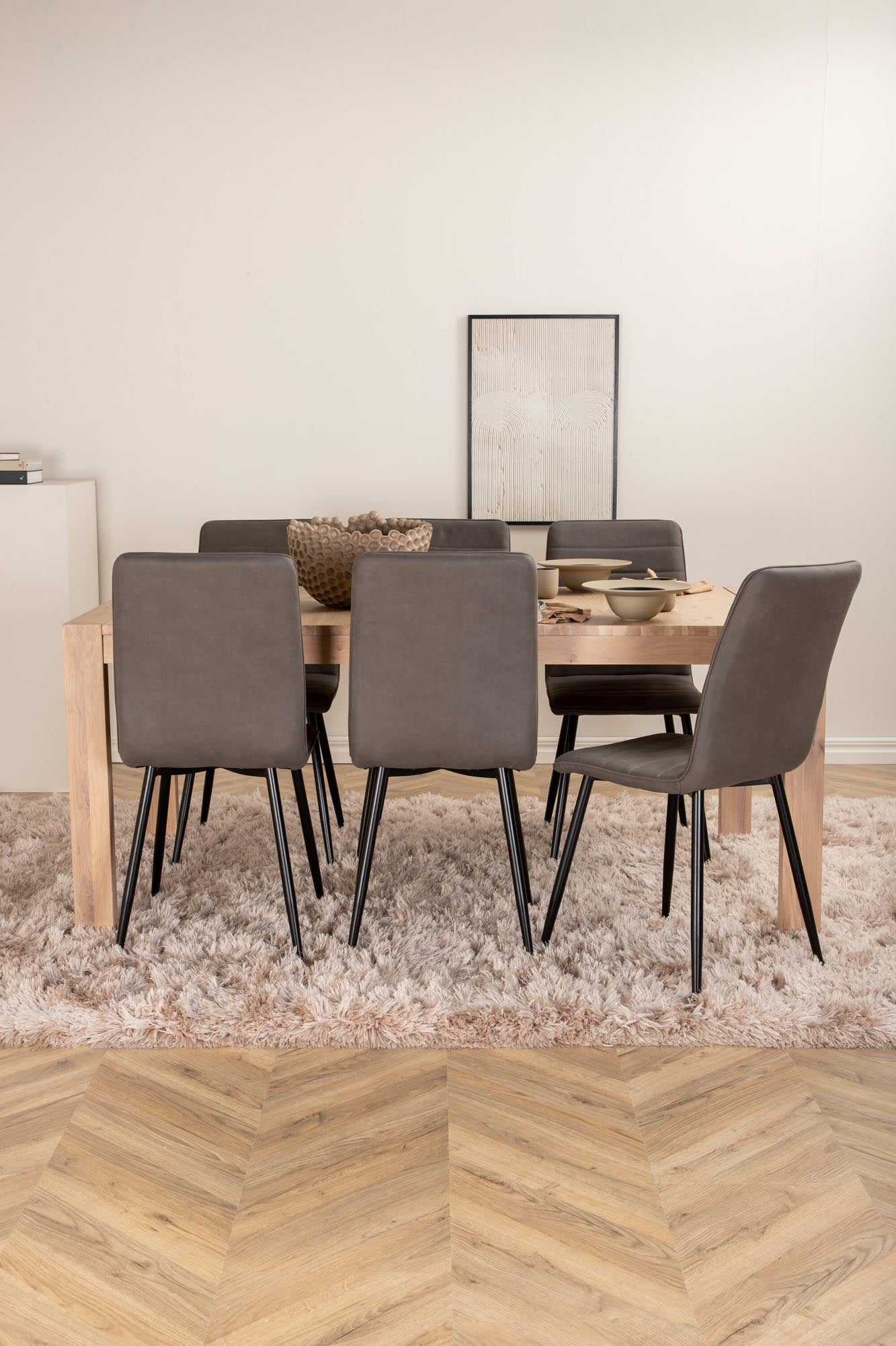 Modernes, ausziehbares Esszimmerset mit 6 komfortablen Windu Stühlen aus Mikrofaser und eleganter Eichenfurnier-Tischplatte, perfekt für gesellige Abende.