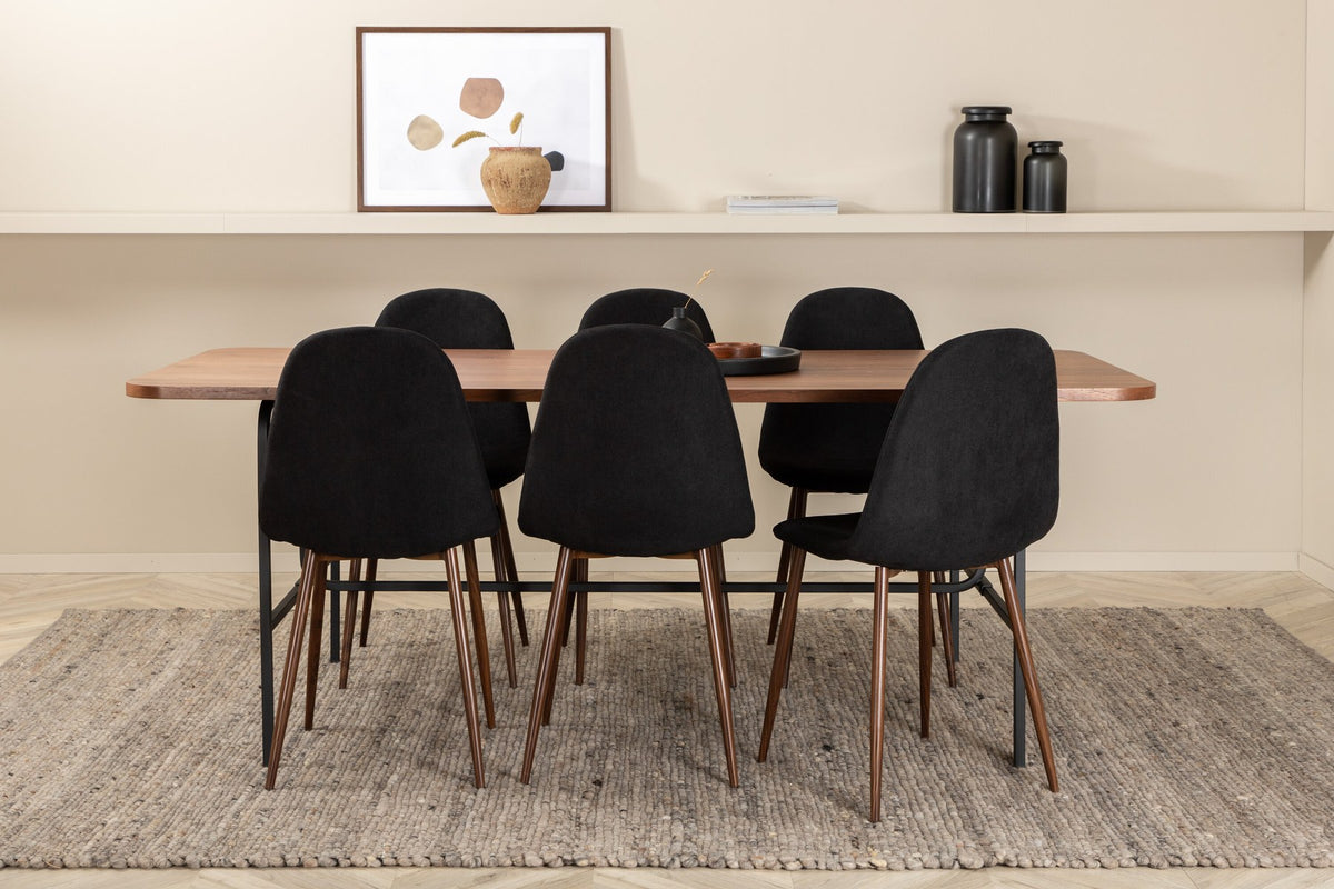 Rechteckiger Esstisch mit Nussbaum-Furnierplatte aus MDF und schwarzem Stahluntergestell, umgeben von sechs gepolsterten Polar Stühlen mit schwarzem Polyesterbezug.