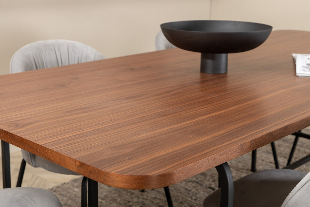 Esszimmerset Uno mit rechteckigem MDF-Tisch in Nussbaum-Furnier und schwarzem Stahlgestell, sechs Wrinkles Stühle mit grauem Samtbezug.