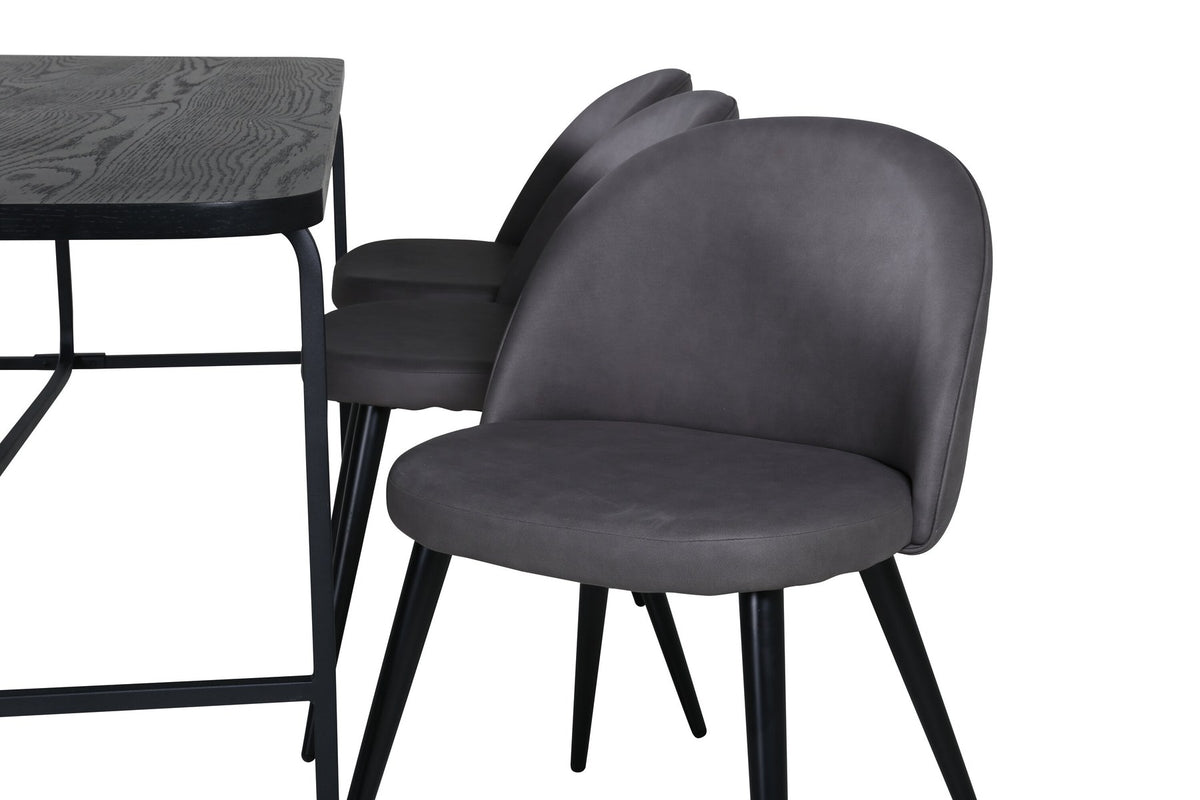 Esszimmerset Uno & Velvet: rechteckiger Esstisch mit schwarzer MDF-Furnier-Platte und Metallgestell, dazu Stühle mit grauem Samtbezug und Eisenbeinen.
