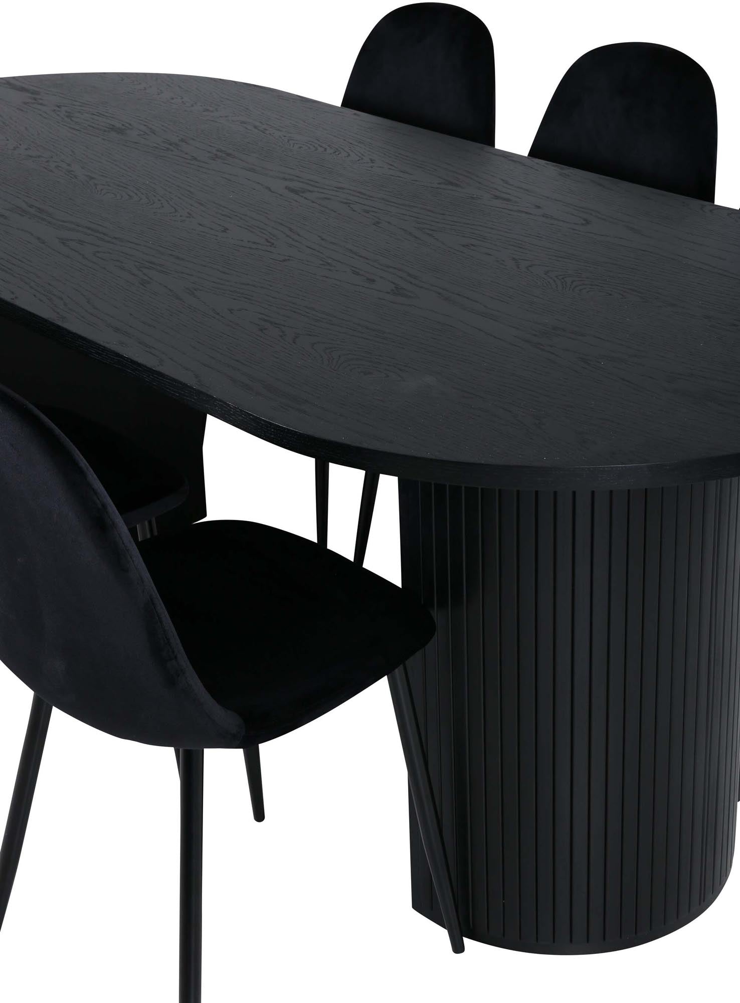 Stilvolles Esszimmerset: Schwarzer Tisch mit Rippendesign, 6 Samtstühle, modern und einladend für gesellige Runden.