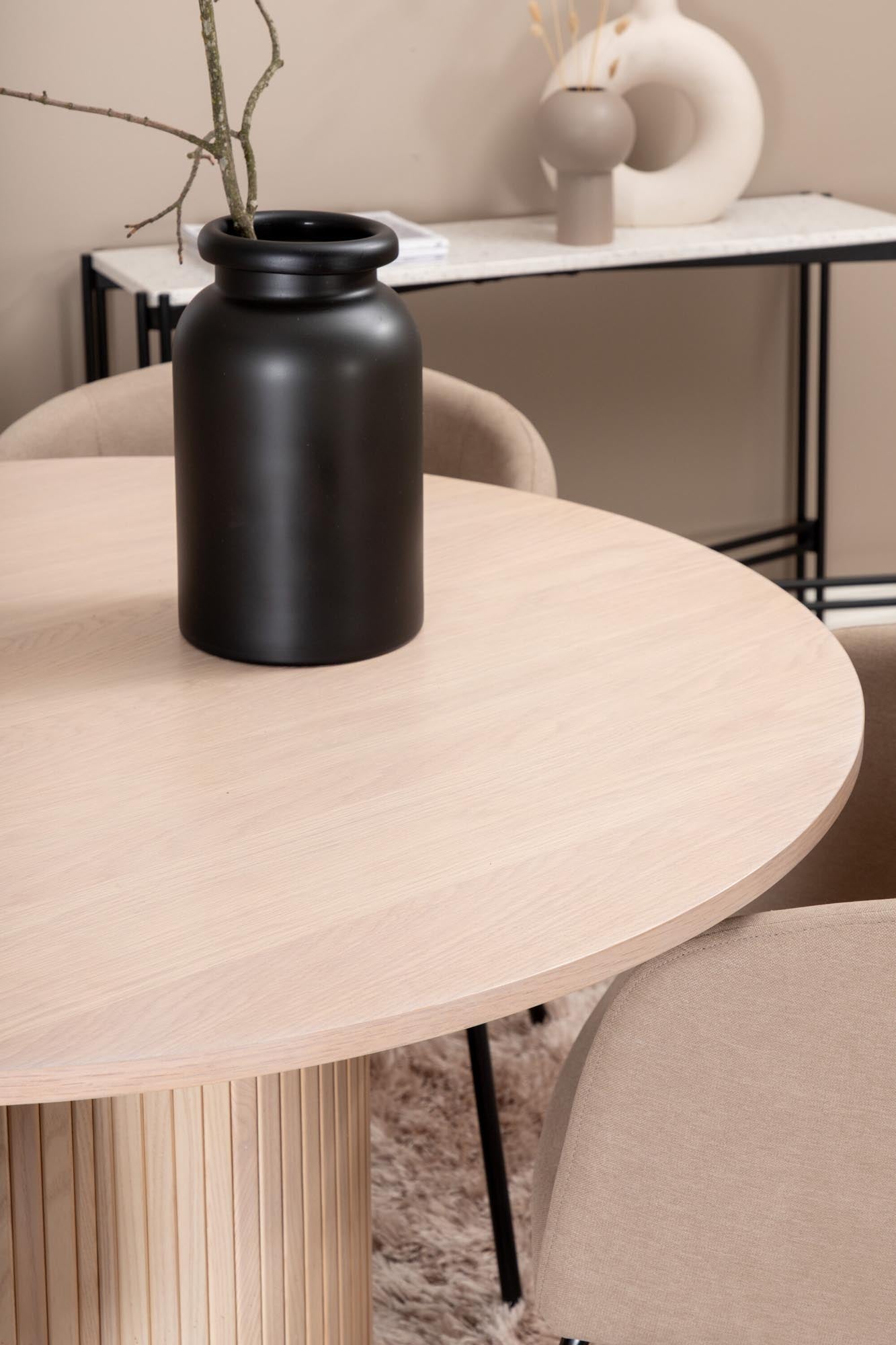 Modernes Esszimmerset Bianca: Stilvoller runder Tisch mit 4 bequemen Samt-Stühlen, ideal für gesellige Abende und elegantes Ambiente.