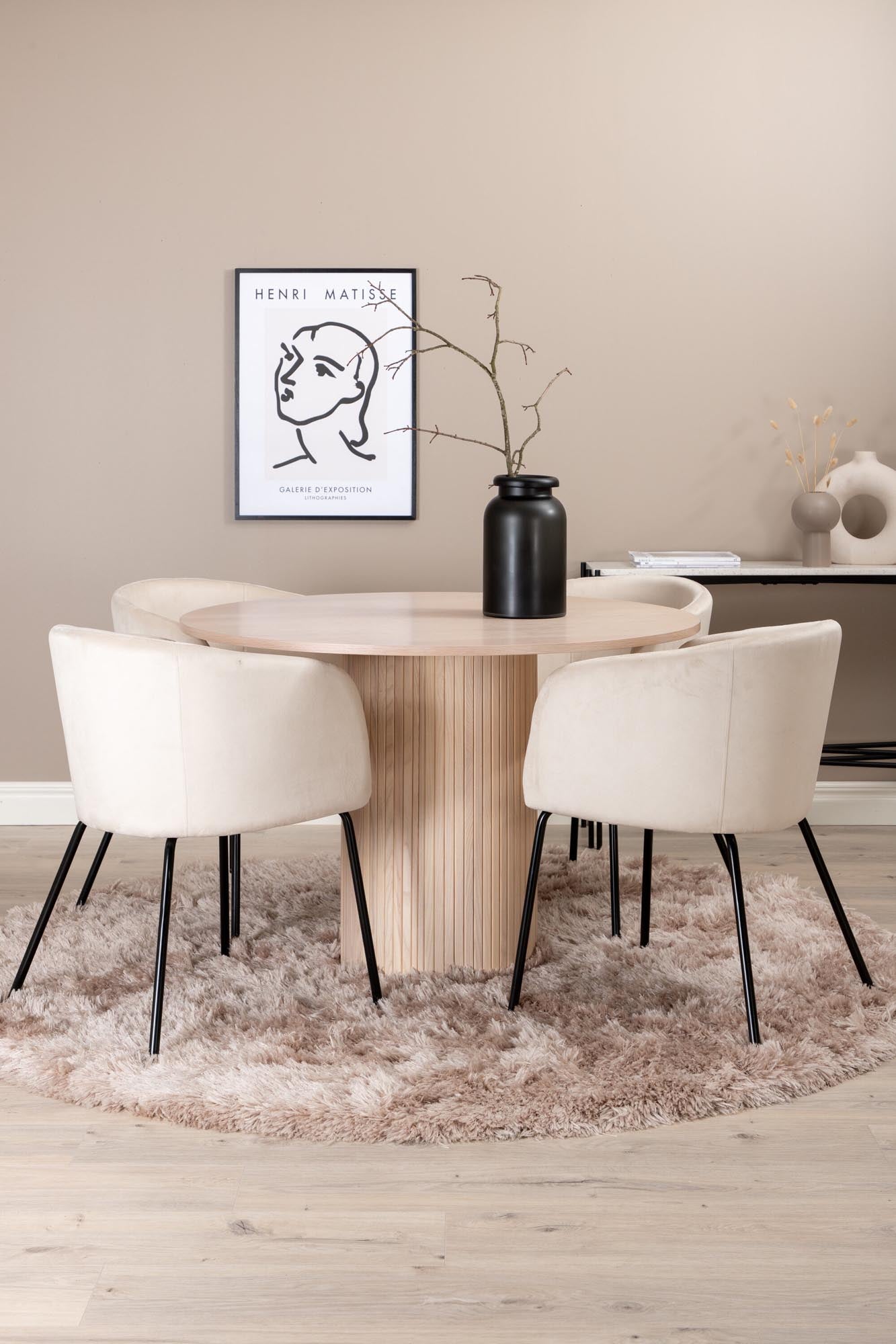 Modernes Esszimmerset Bianca: Stilvoller runder Tisch mit 4 bequemen Samt-Stühlen, ideal für gesellige Abende und elegantes Ambiente.