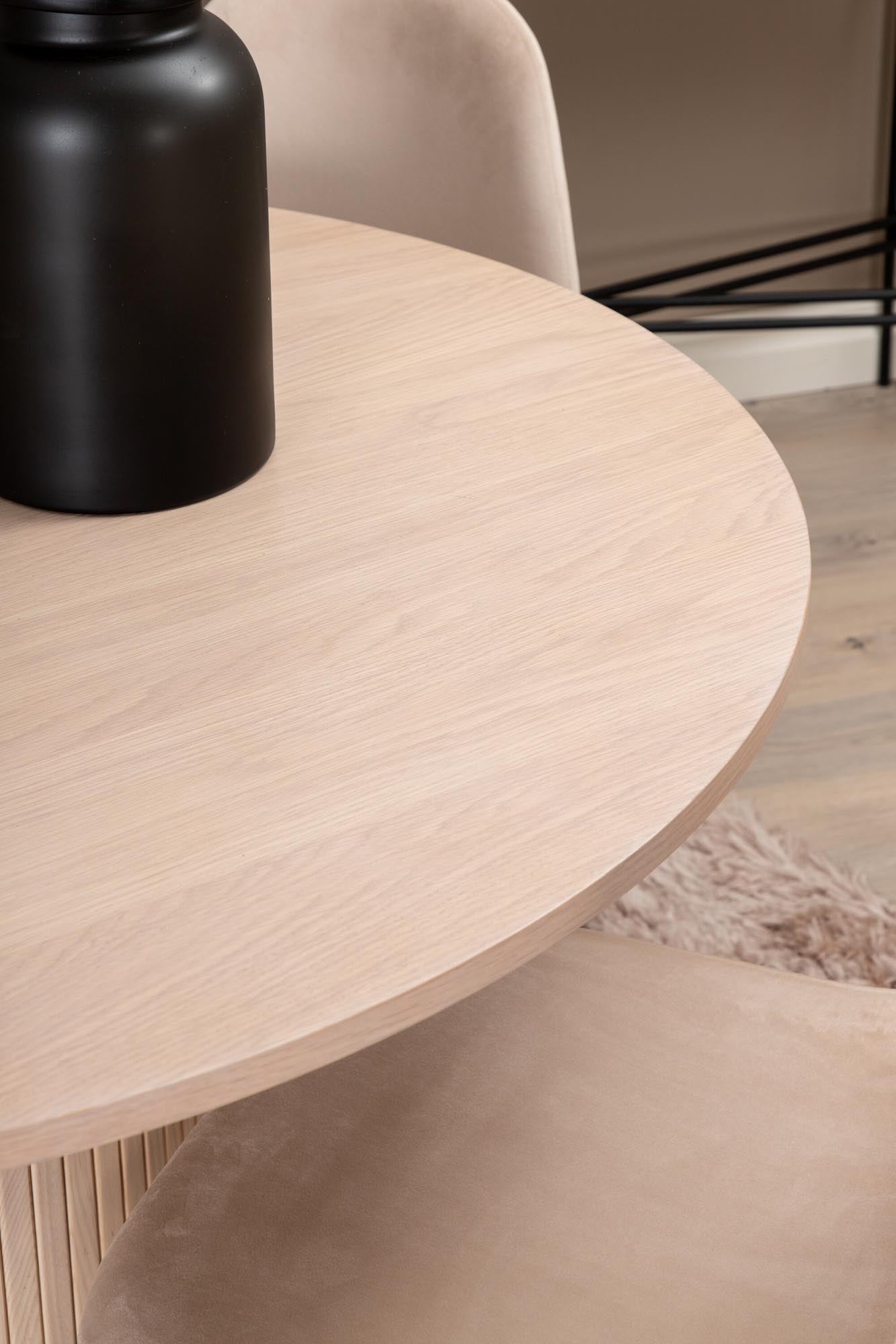 Stilvolles Bianca Esszimmerset mit elegantem runden Tisch und luxuriösen Samtstühlen. Perfekt für moderne Essbereiche!