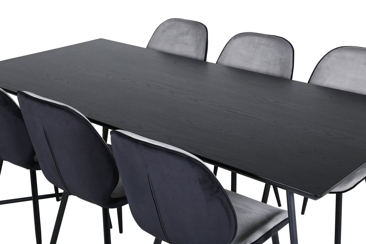 Esszimmerset Emma & Petra von Venture Home: rechteckiger Tisch aus MDF mit Furnier in Schwarz und zwei Stühle mit Bugholzgestell in Grau.