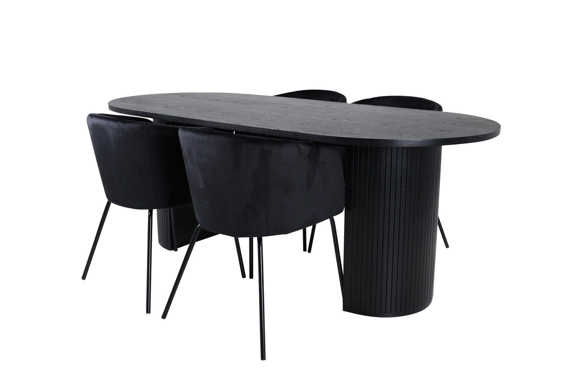 Schwarzes Esszimmerset aus MDF mit ovalem Esstisch und vier Stühlen mit Samtsitz und schlankem Eisengestell, Ansicht von vorne.