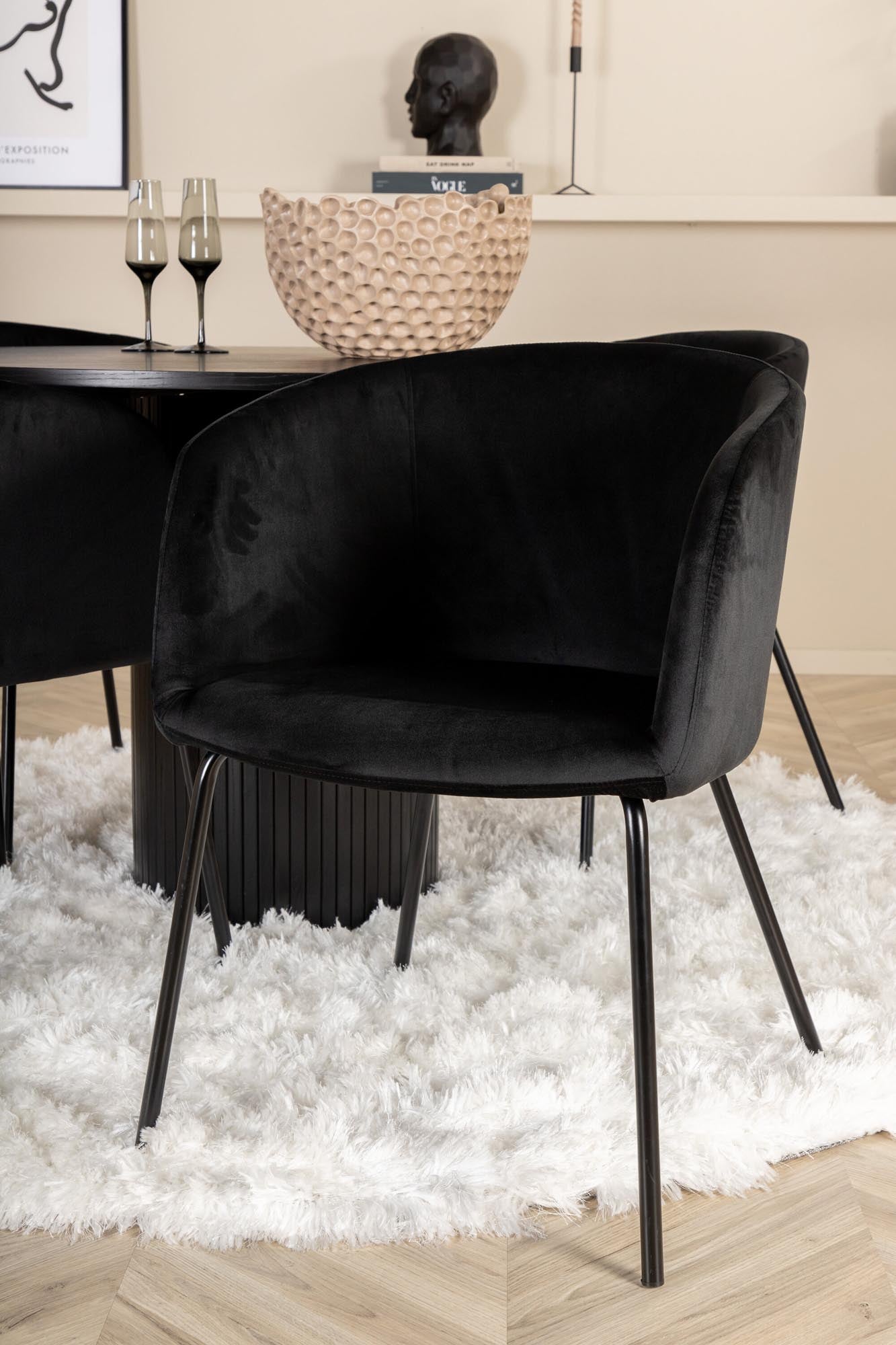 Elegantes Bianca Esszimmerset mit runder MDF-Tischplatte und 4 luxuriösen Berit Samtstühlen für gesellige Abende und stilvolle Einrichtung.