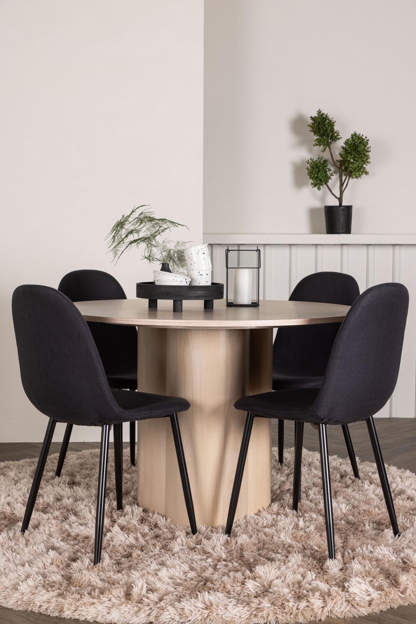 Elegantes Olivia Esszimmer Set mit runder Tischplatte und 4 komfortablen Samt-Stühlen. Ideal für gesellige Abende und stilvolle Einrichtung.