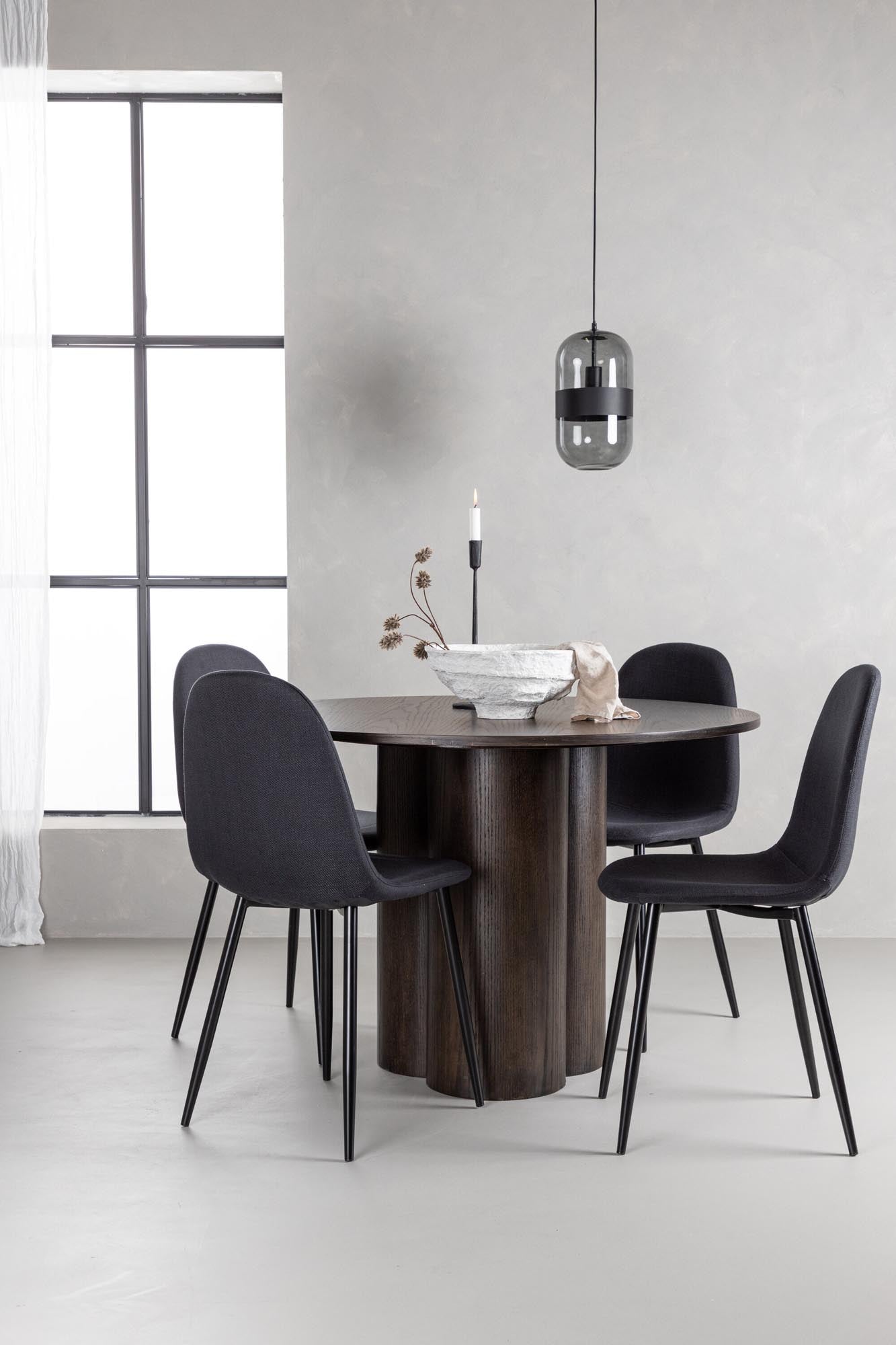 Elegantes Esszimmer Set mit skandinavischem Design: runder Tisch und 4 bequeme Samt-Stühle für gesellige Abende.