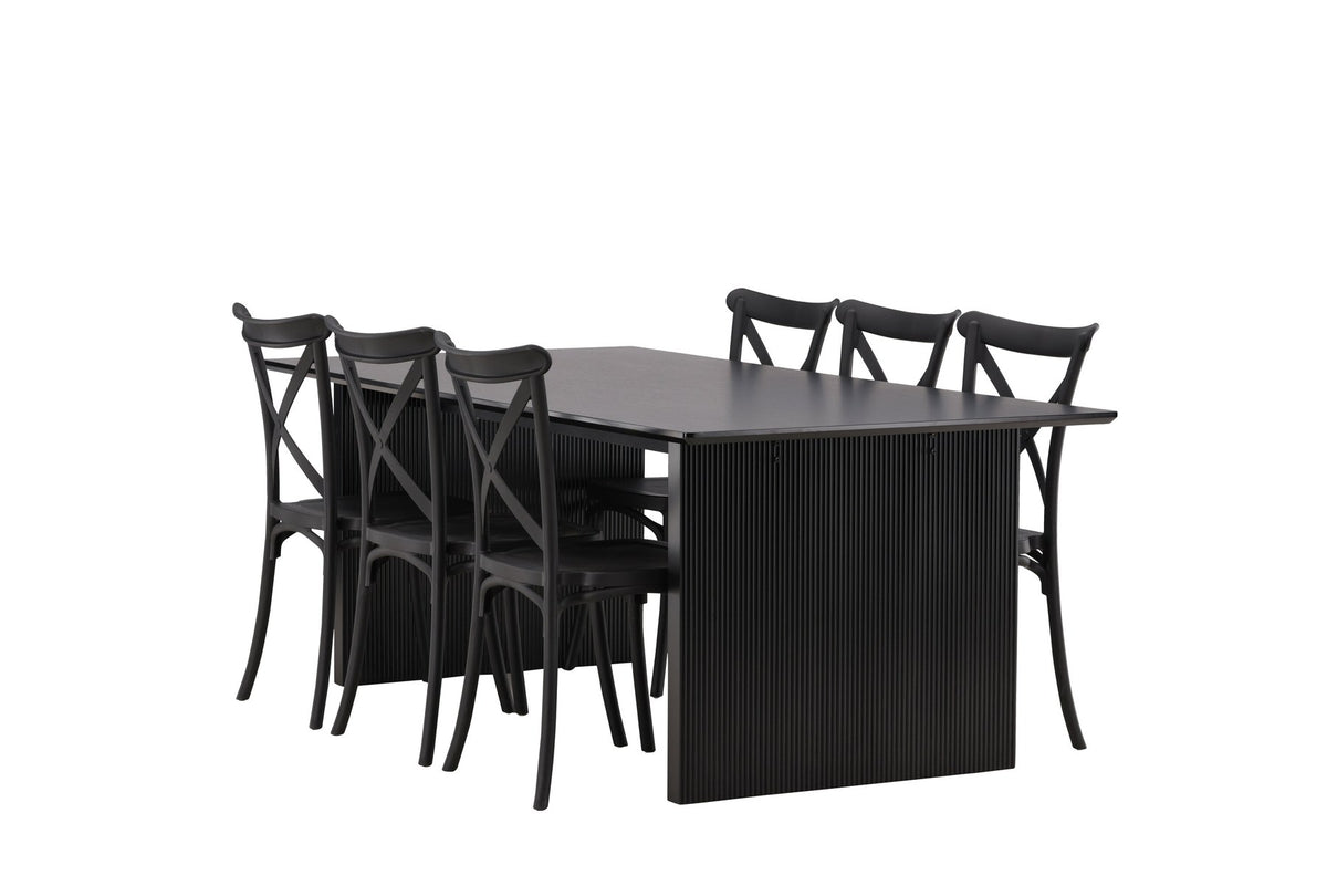 Esszimmerset aus rechteckigem MDF-Tisch in Rauchschwarz mit sechs Limhamn-Stühlen, beiger Samtbezug, muschelförmige Rückenlehne, schwarze Metallbeine.
