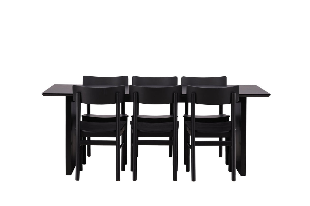 Esszimmerset aus rechteckigem MDF-Tisch in Rauchschwarz mit sechs Limhamn-Stühlen, beiger Samtbezug, muschelförmige Rückenlehne, schwarze Metallbeine.
