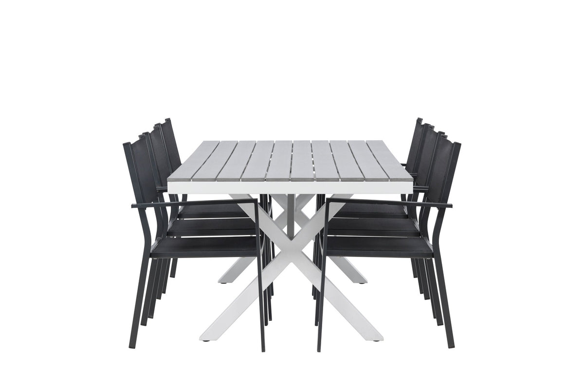 Rechteckiger Gartentisch Garcia mit Aluminiumgestell und Aintwood-Platte, umgeben von sechs stapelbaren Copacabana-Stühlen mit Textilene-Sitzfläche.