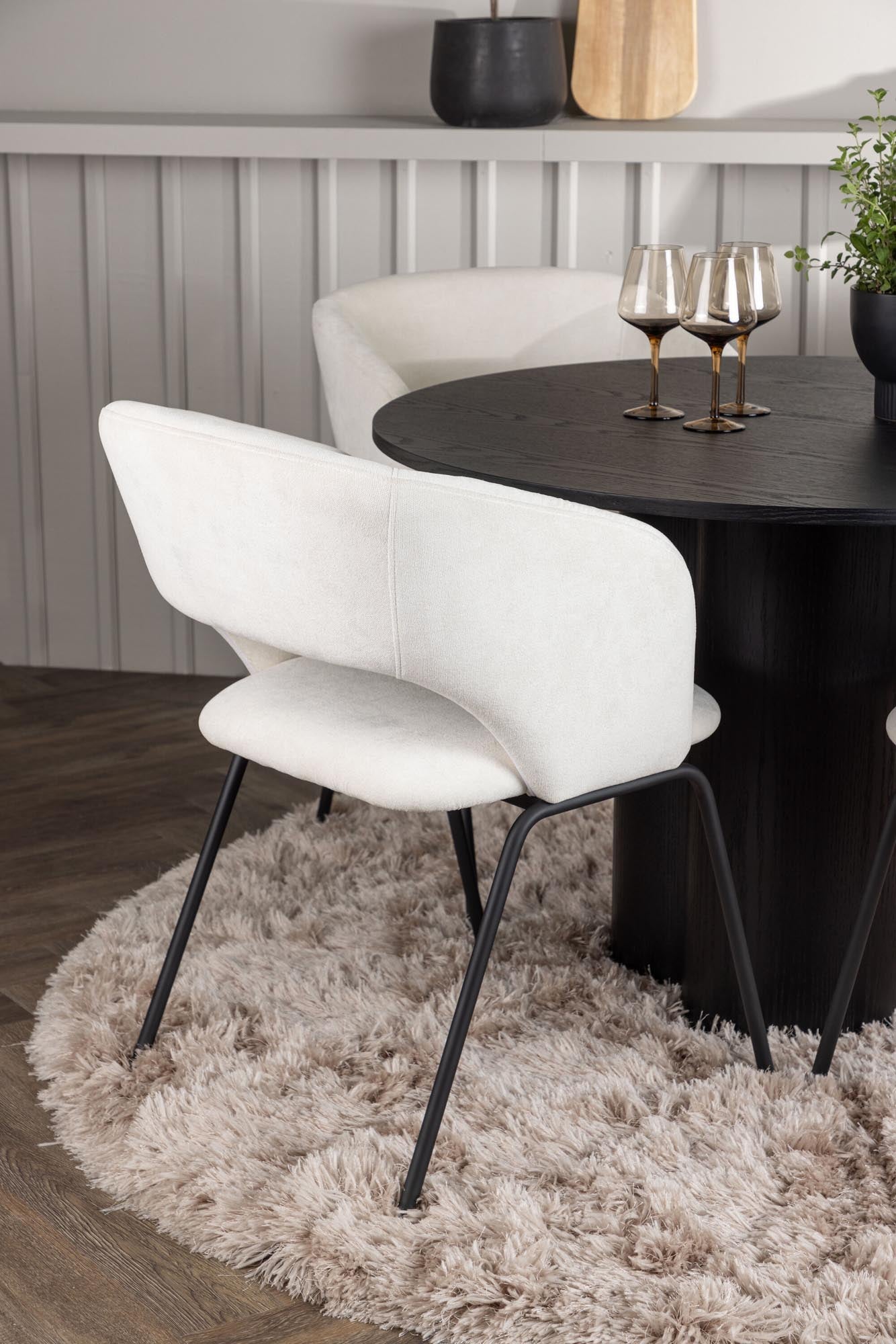 Elegantes Esszimmerset mit runden Tisch (⌀110cm) und 4 komfortablen Stühlen. Ideal für gesellige Anlässe und modernes Wohnen.