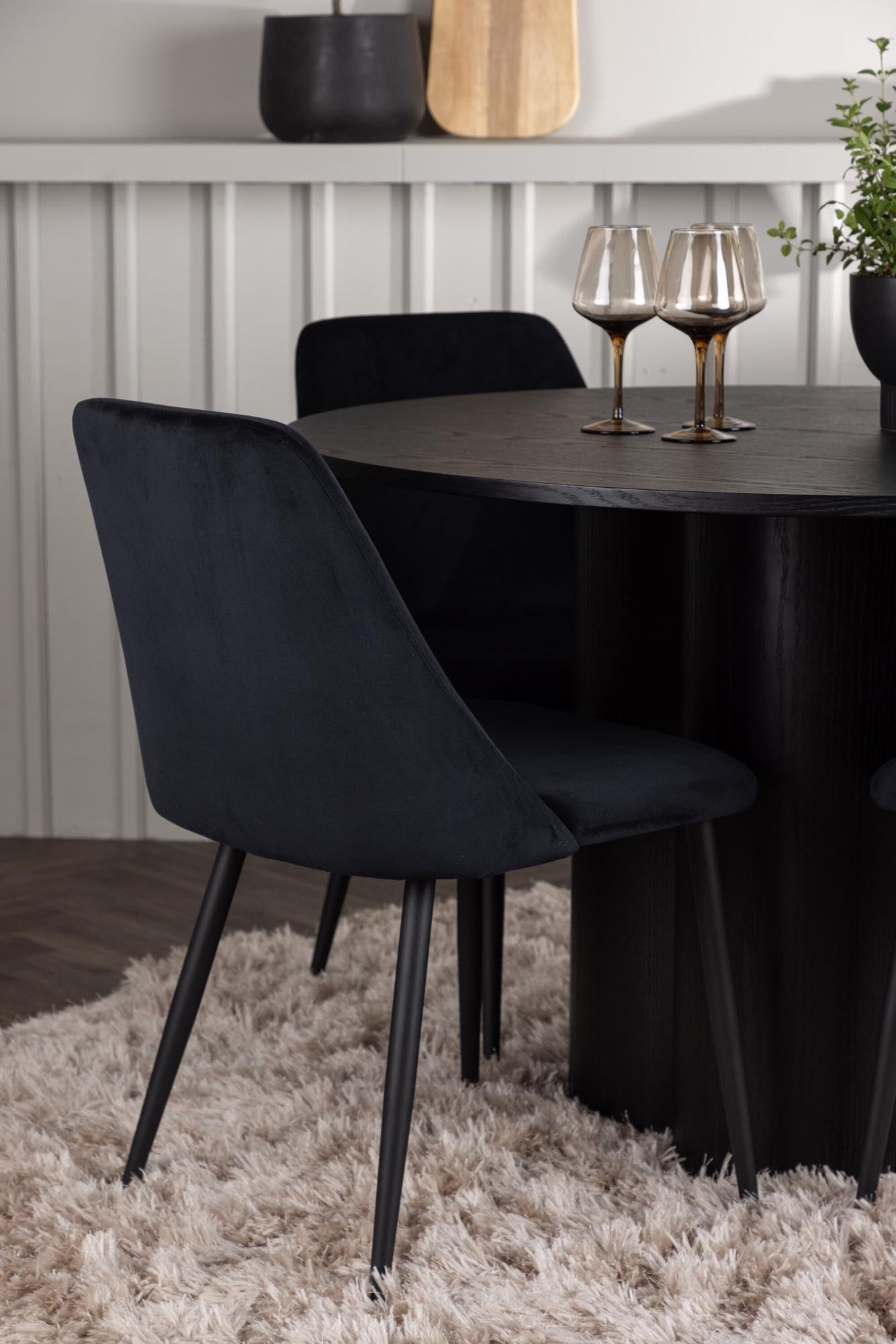 Elegantes Olivia Esszimmerset mit rundem Tisch (110cm) und 4 bequemen Stühlen. Perfekt für stilvolle Dinner und gemütliche Zusammenkünfte.