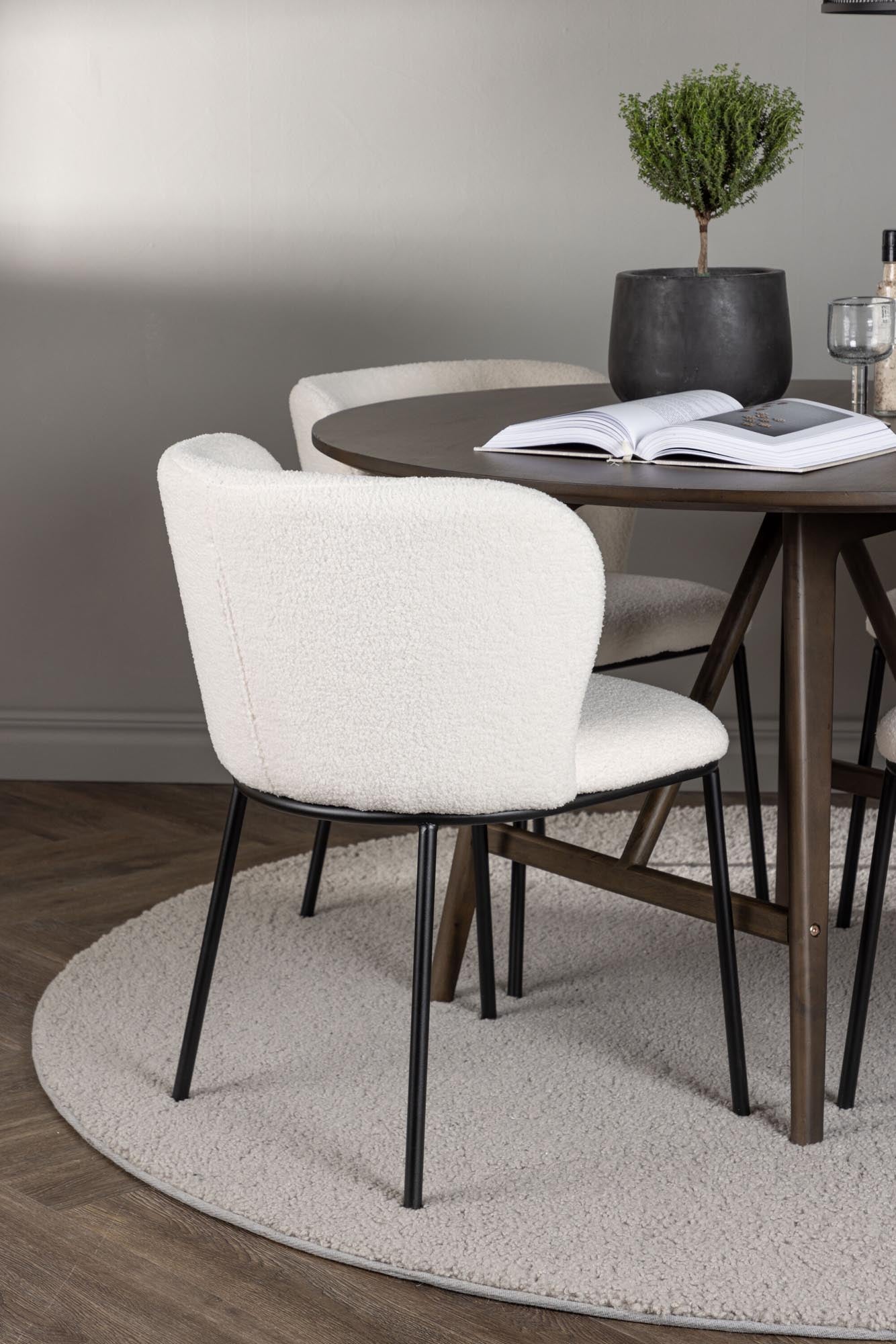 Stilvolles Esszimmerset Kaseindon + Edina: runder Tisch und 4 bequeme Stühle für gesellige Momente und elegantes Ambiente.