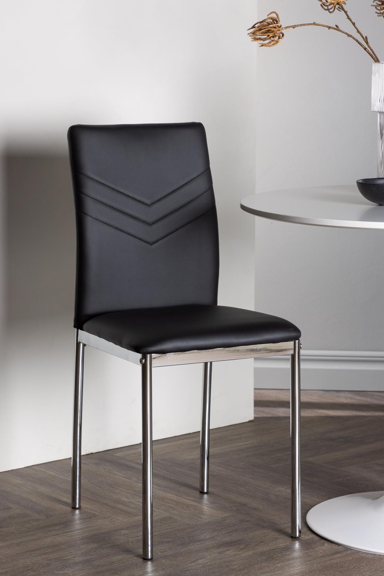 Stilvolles Esszimmerset: Runder MDF-Tisch mit Trompetenfuß und elegante Kunstlederstühle, perfekt für gemütliche Essbereiche.